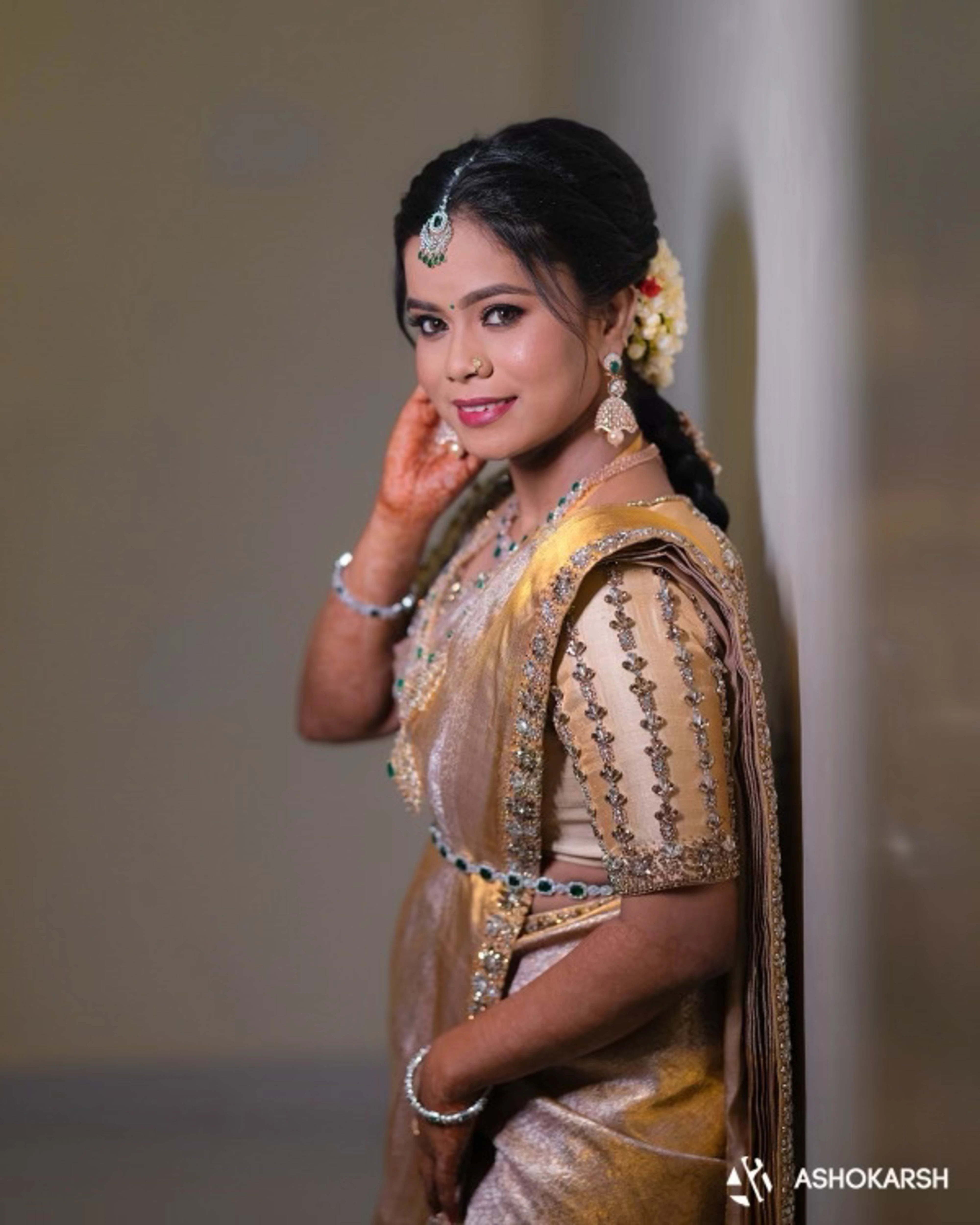 Bride Kushmma posing for photo in a silk blouse & saree border by Archana Karthick