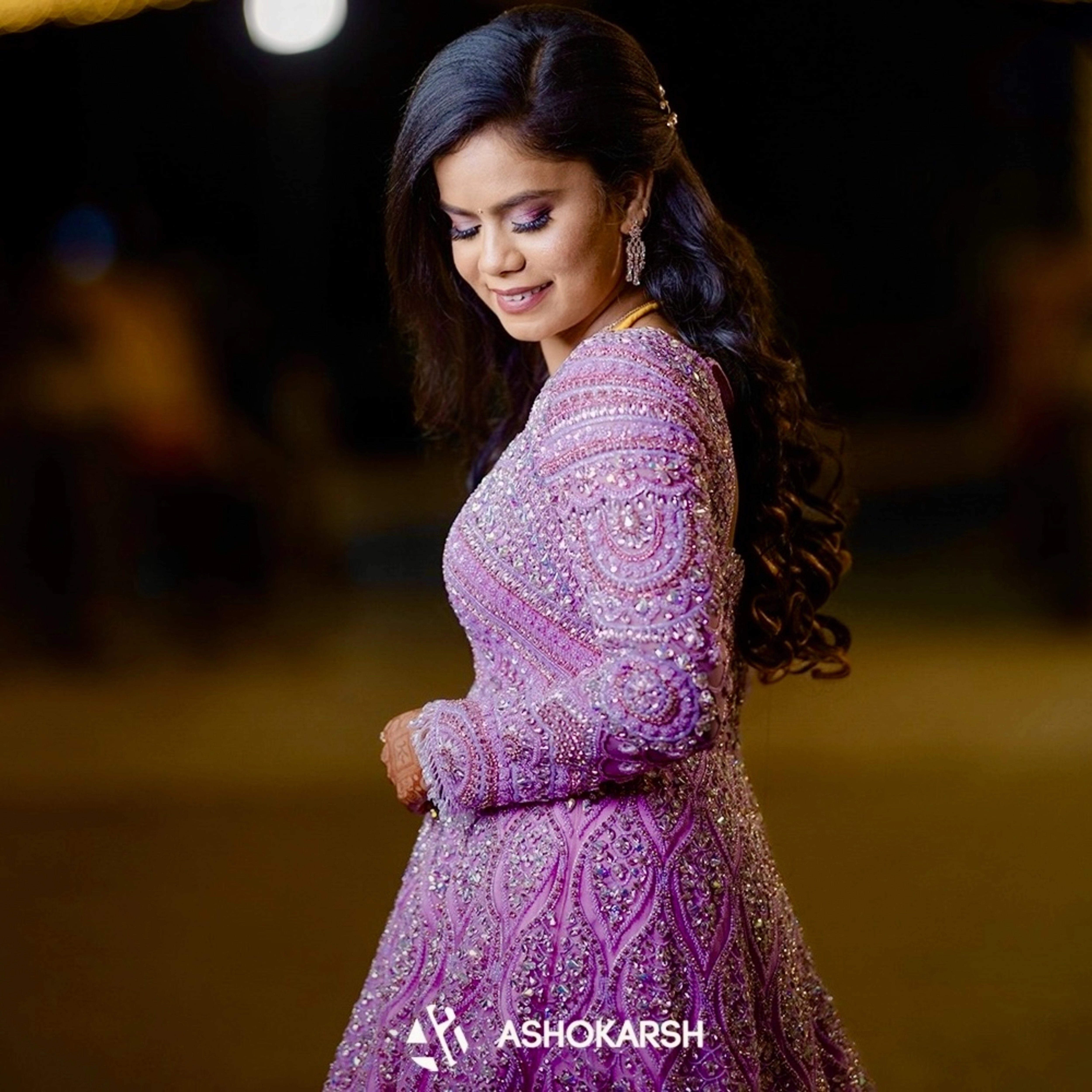 Bride Kushmma posing in a lilac pink ombre gown by team Archana Karthick