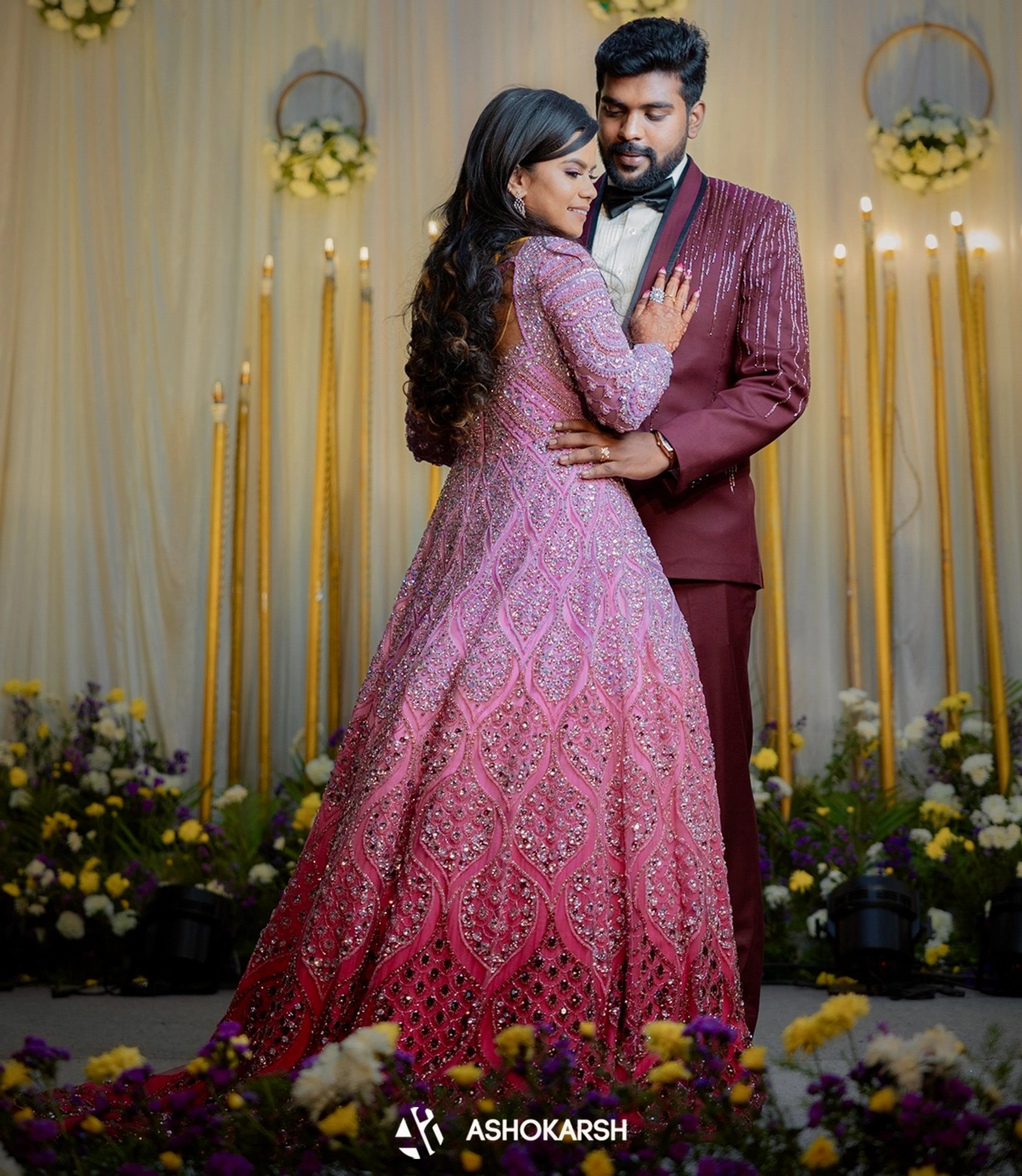 Bride Kushmma posing with groom in a lilac pink ombre gown by team Archana Karthick