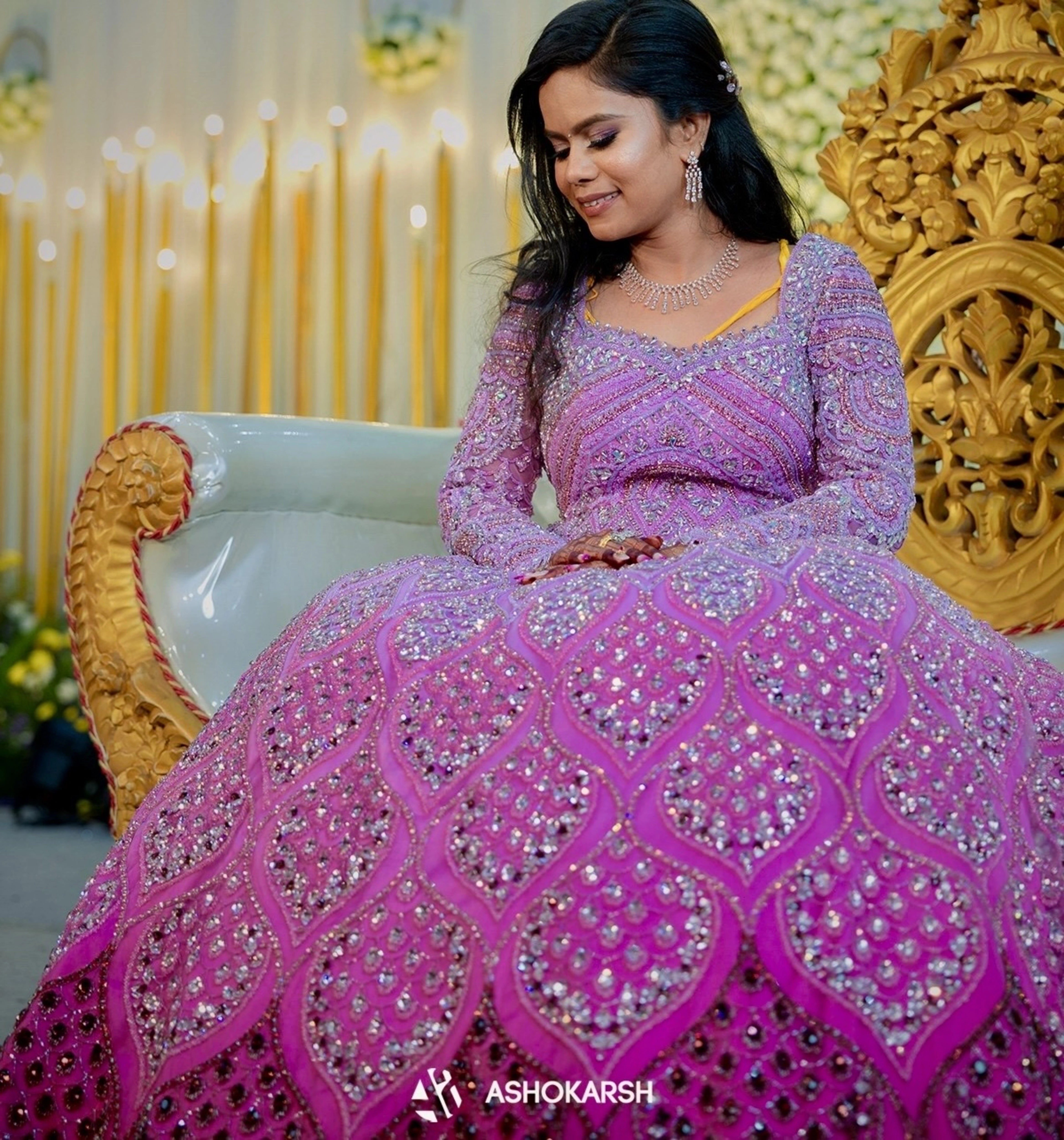 Bride Kushmma seated in a lilac pink ombre gown by team Archana Karthick