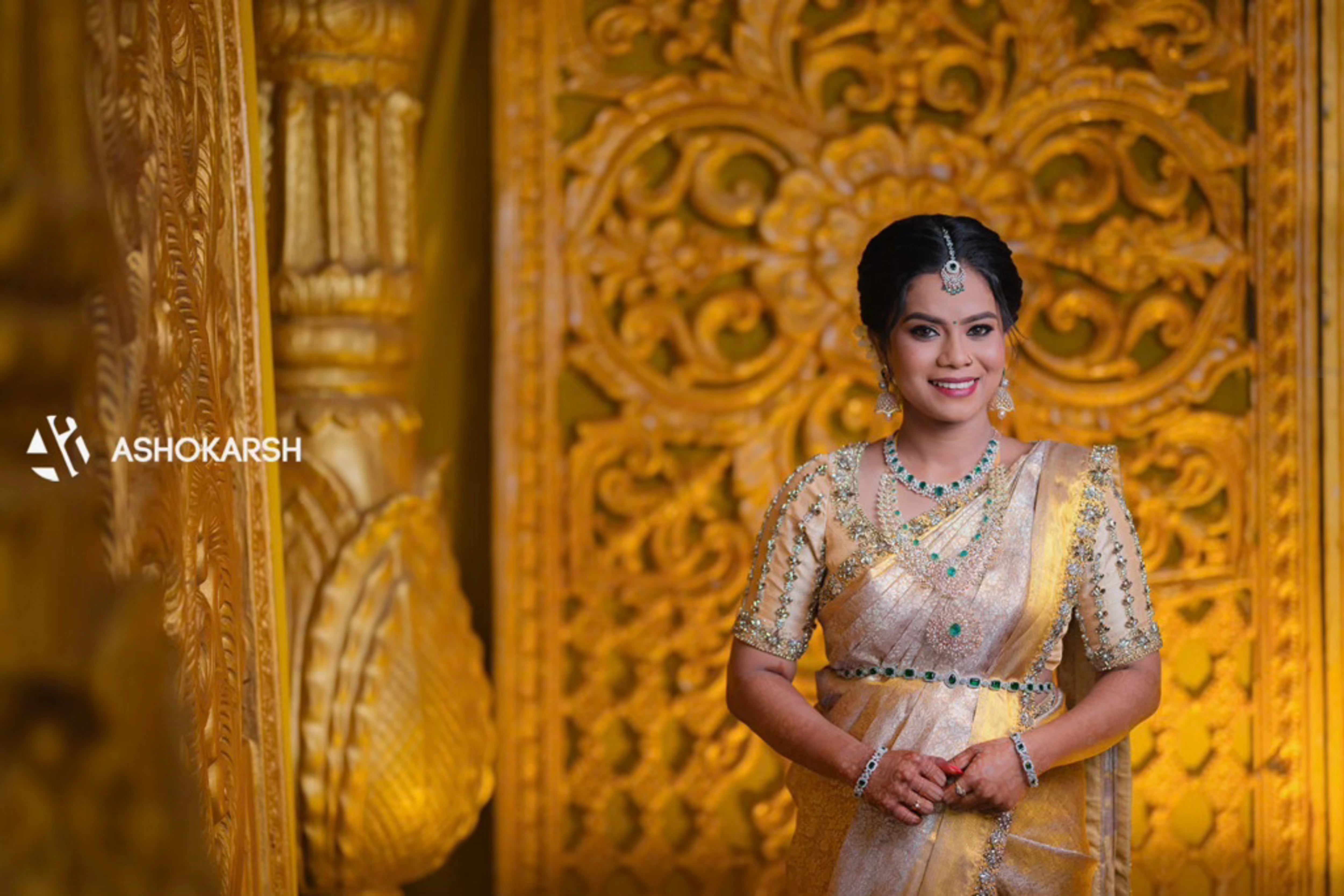 Bride Kushmma smiling for photo in a silk blouse & saree border by Archana Karthick