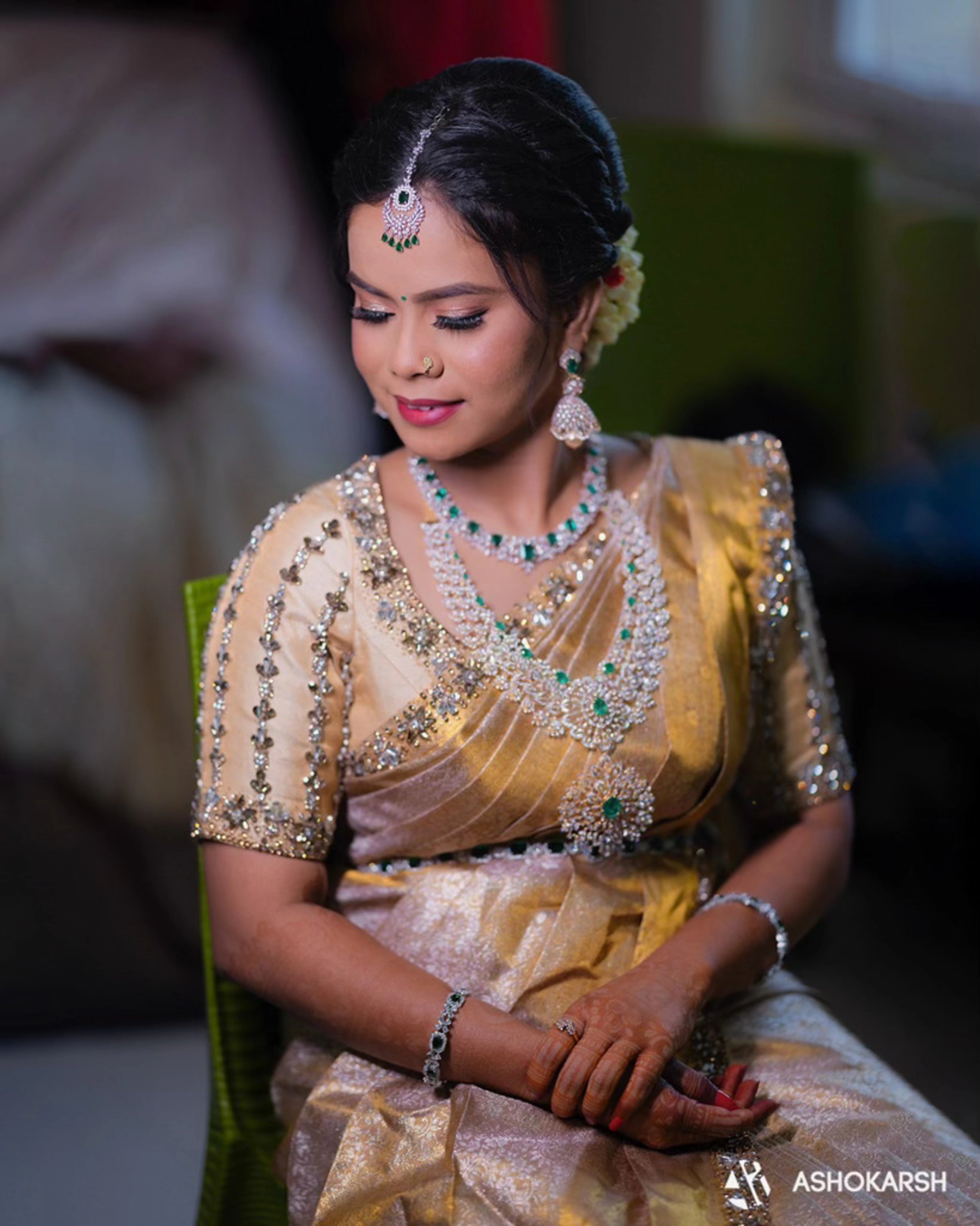Bride Kushmma smiling in a silk blouse & saree border by Archana Karthick