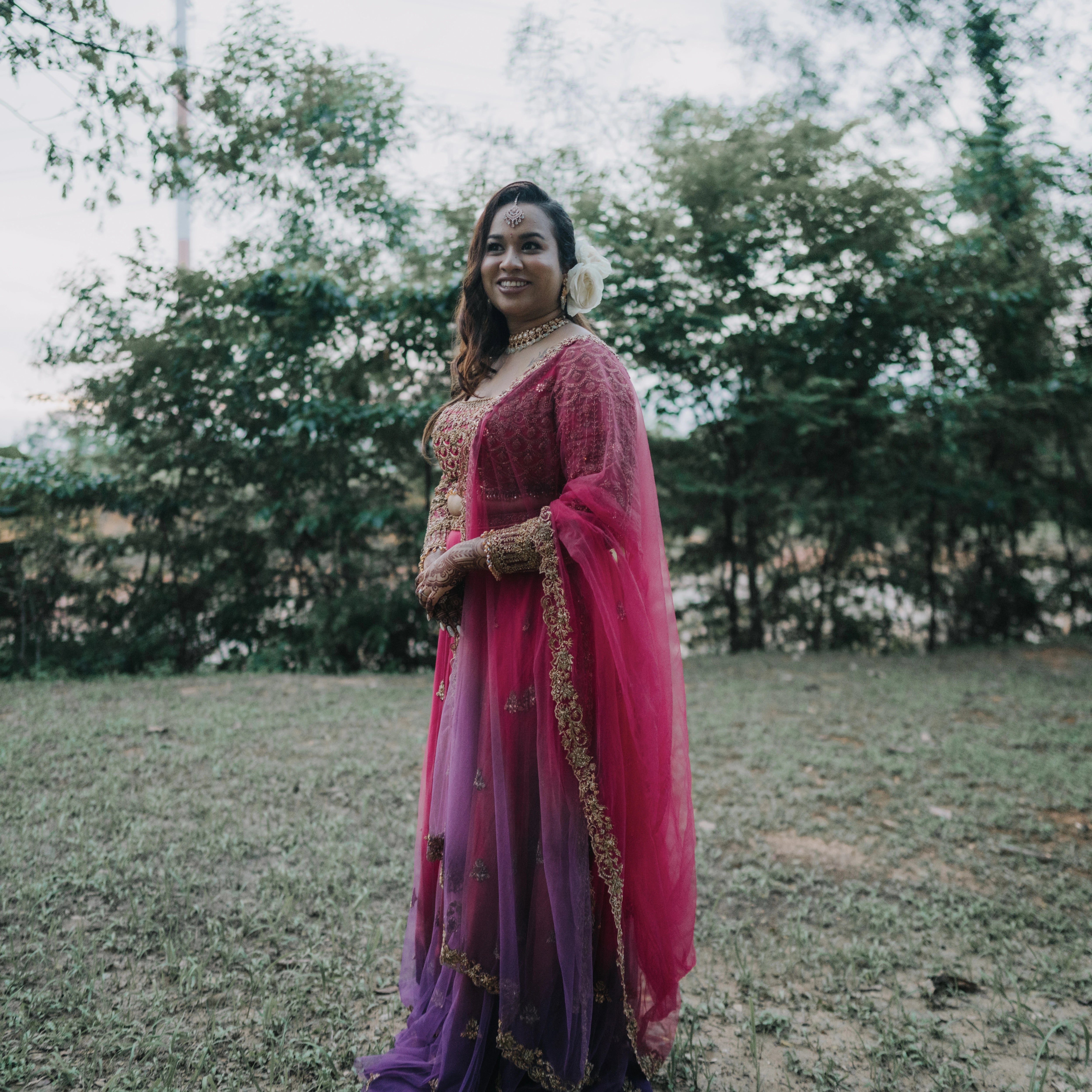 Bride Lalina from Malaysia in a pink & purple ombre lehnega, intricately handcrafted with zardozi, beads, sequions, knot work and crystals.