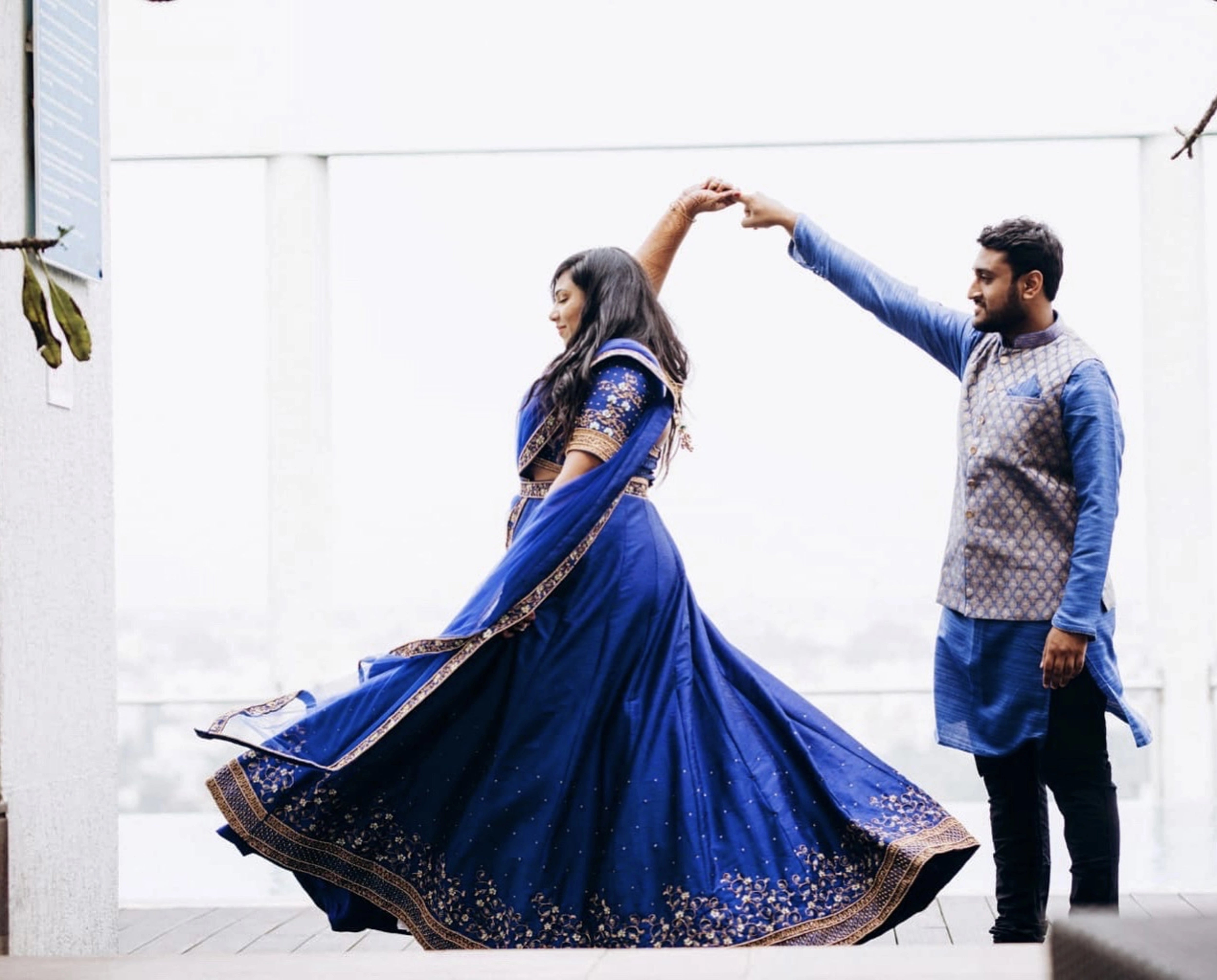 Bride Madhu Loganathan from Texas, US in a blue raw silk lehenga, handcrafted with sequins, cutdana, resham and zardozi by team Archana Karthick.