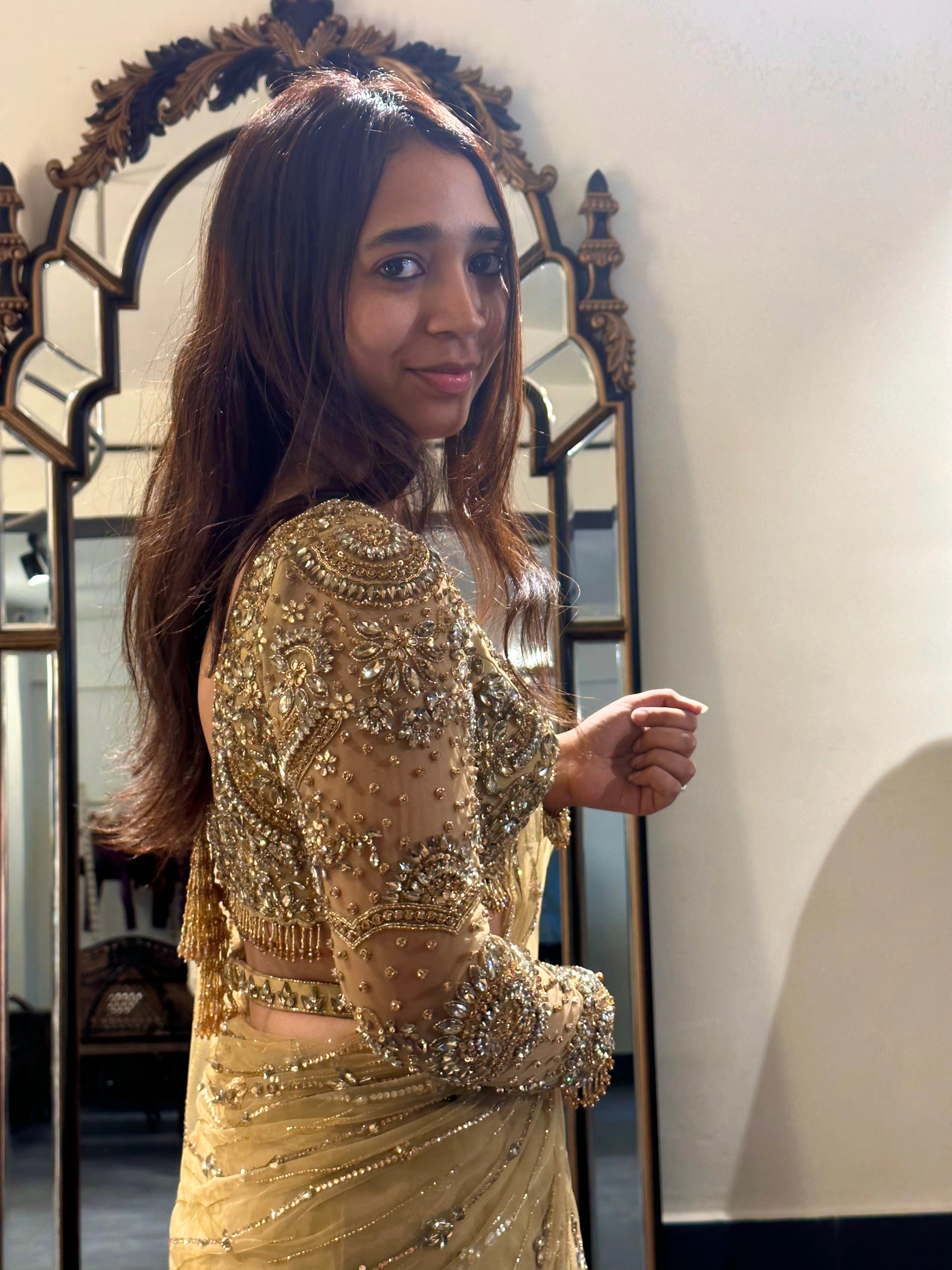 Bride Narmada during fittings in a golden beige tulle saree handcrafted by team Archana Karthick.