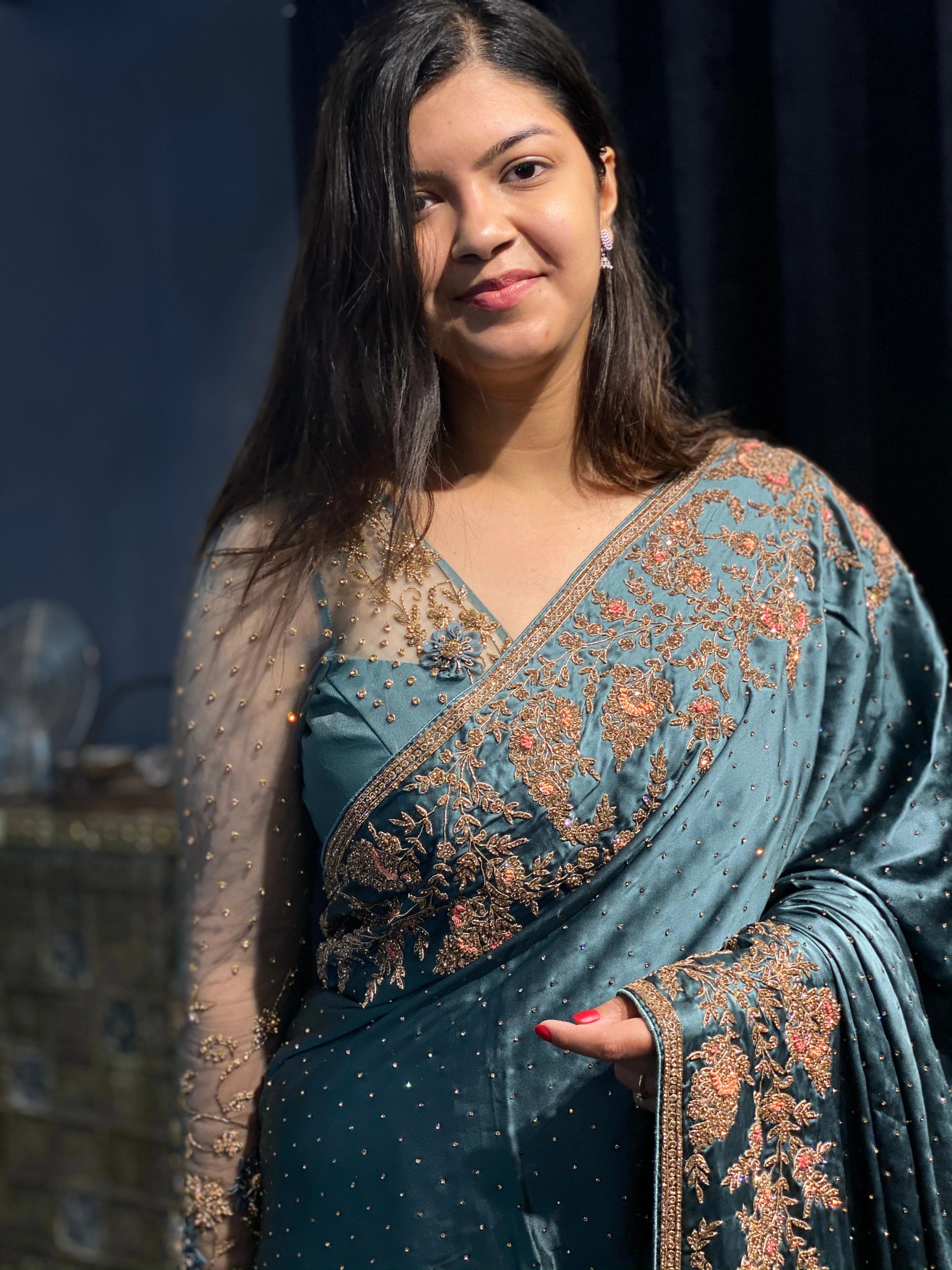 Bride Neha in a blue grey tulle blouse handcrafted by team Archana Karthick.