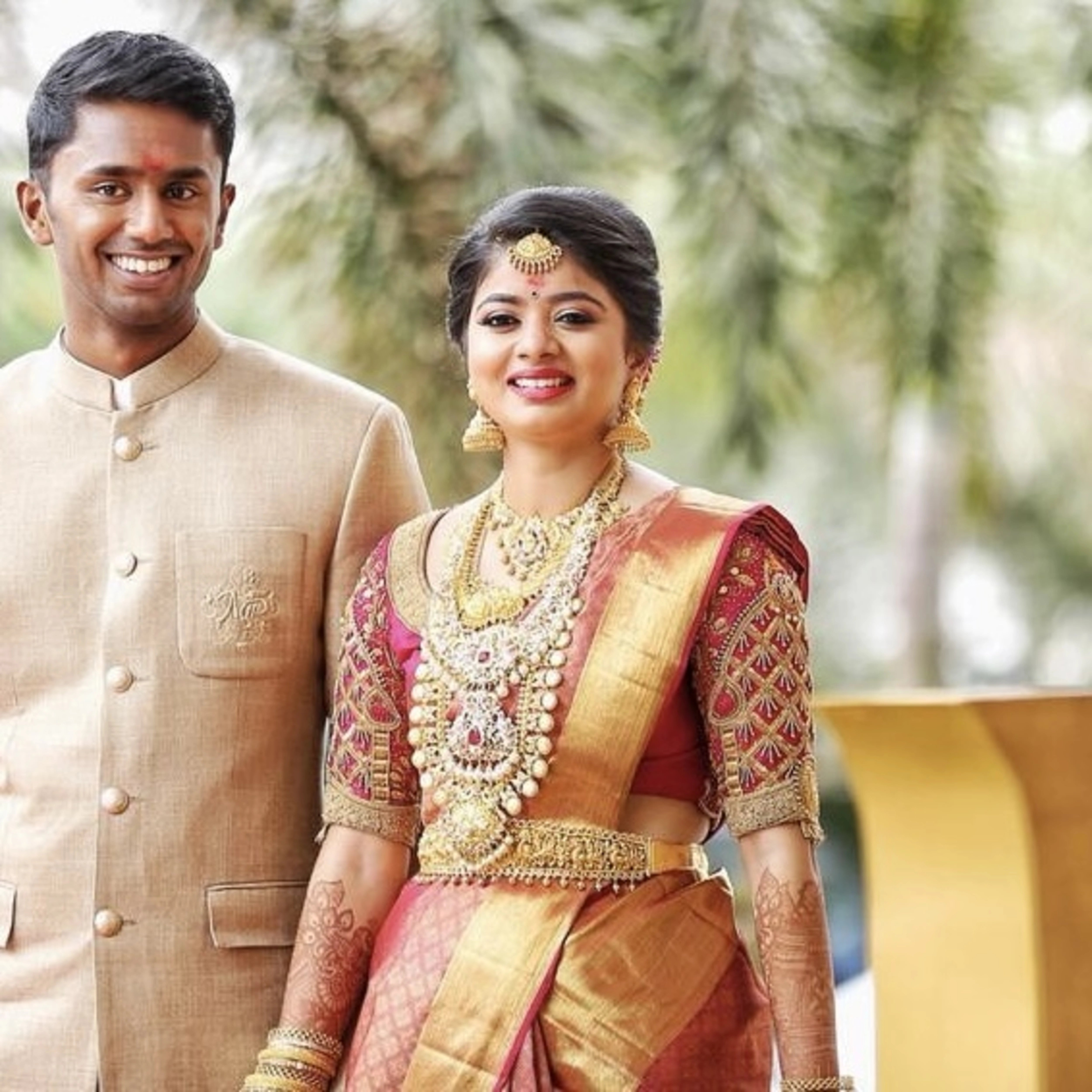 Bride Padma from Coimbatore in a red silk palanquin concept blouse intricately handcrafted with zardozi, stones, beads, sequins etc by team Archana Karthick.