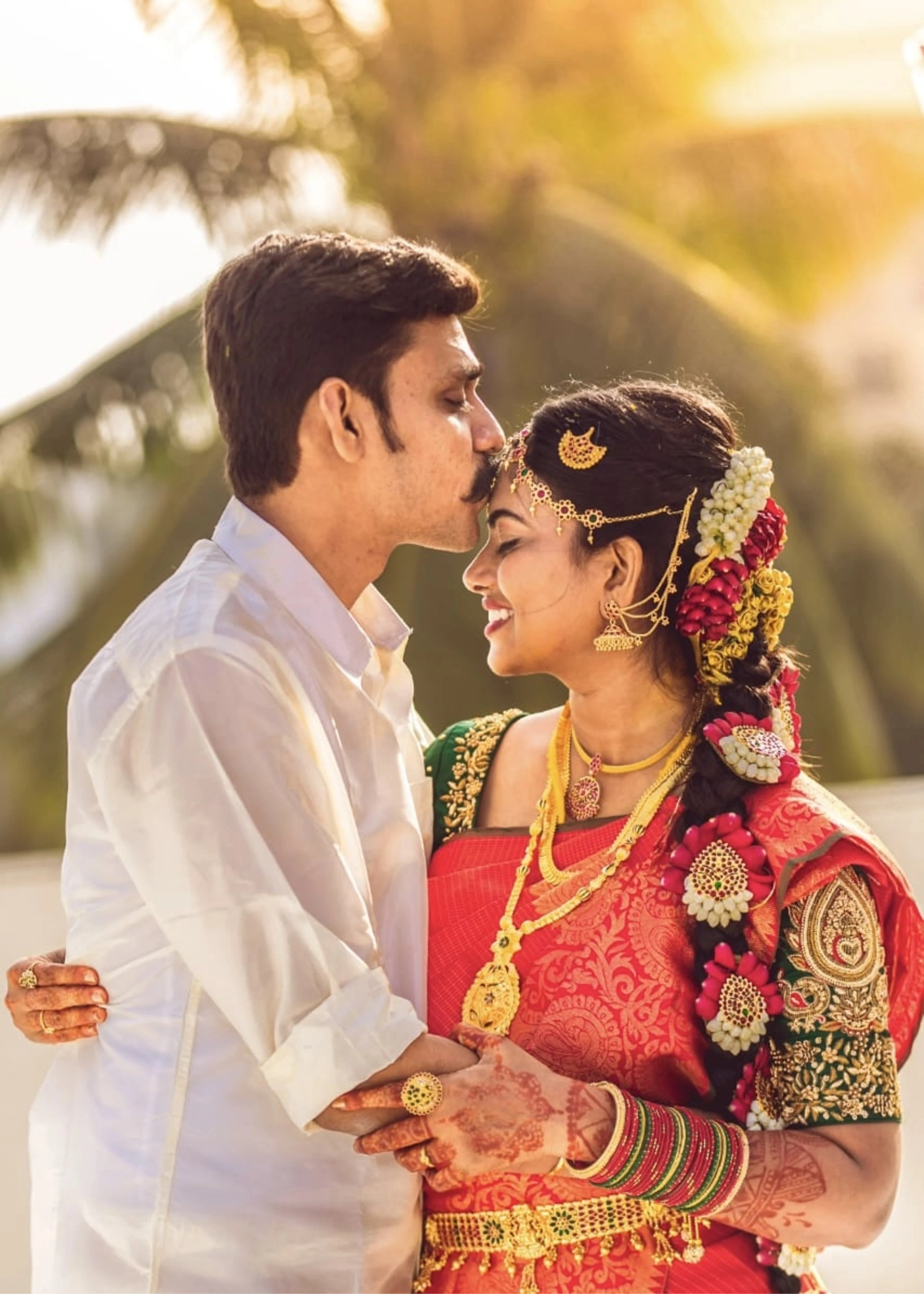 Bride Priya Sathiyan in a green silk blouse, intricately handcrafted with zardozi, resham, and beads by team Archana Karthick.