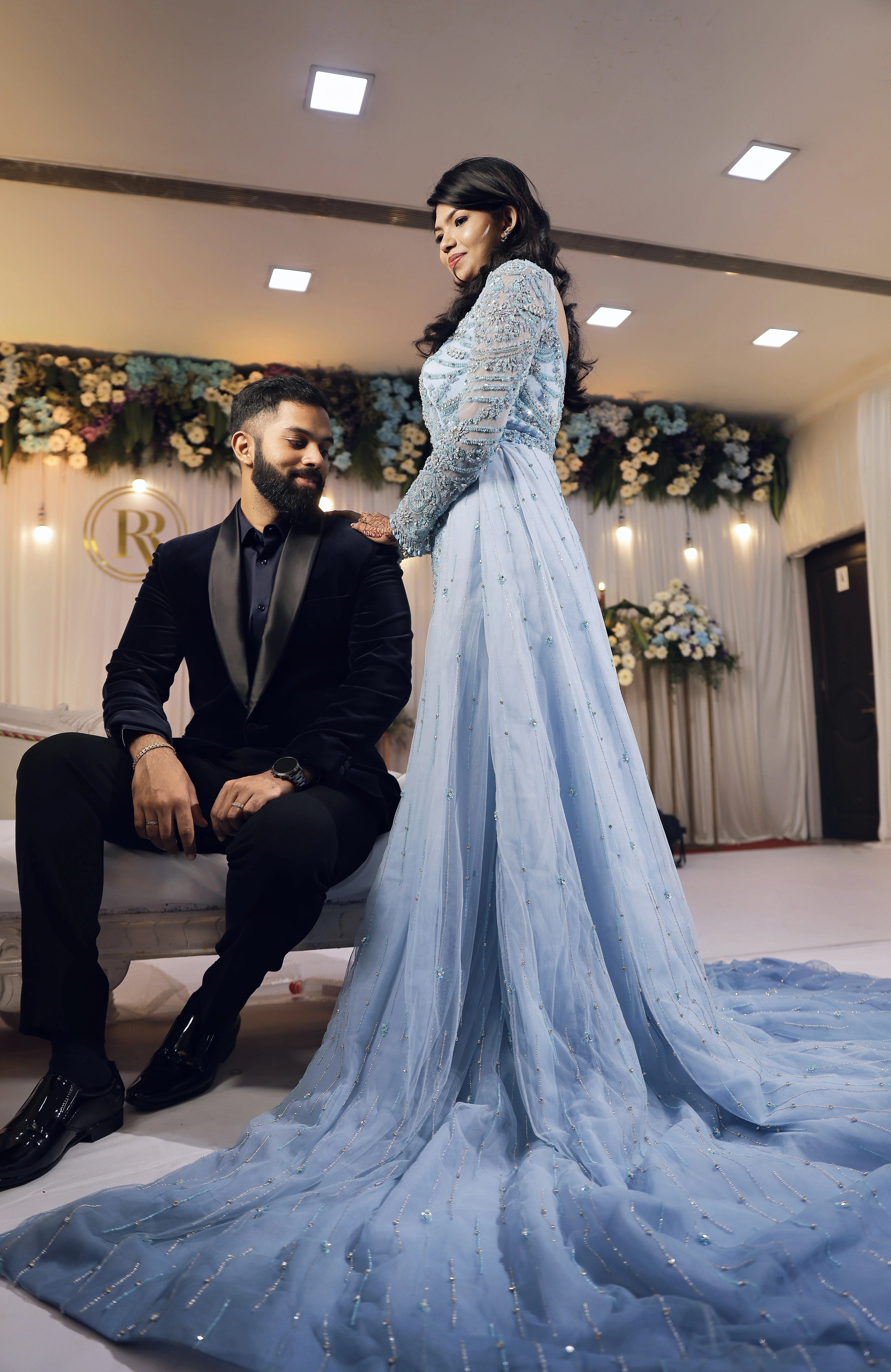 Bride Raxana posing for shoot in a blue tulle mermaid gown by team Archana Karthick.