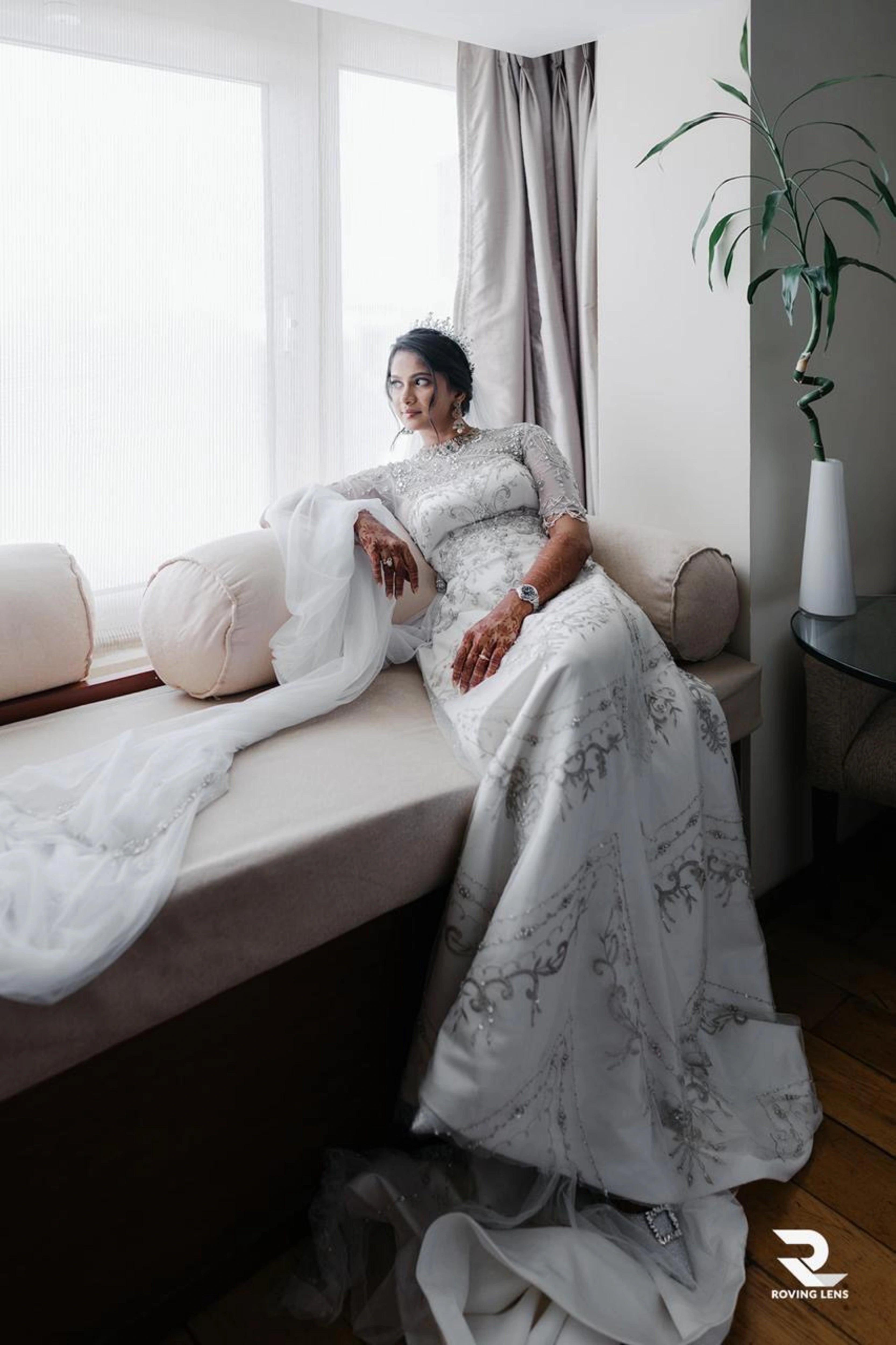 Bride Roushni in a white gown for her church wedding by team Archana Karthick.