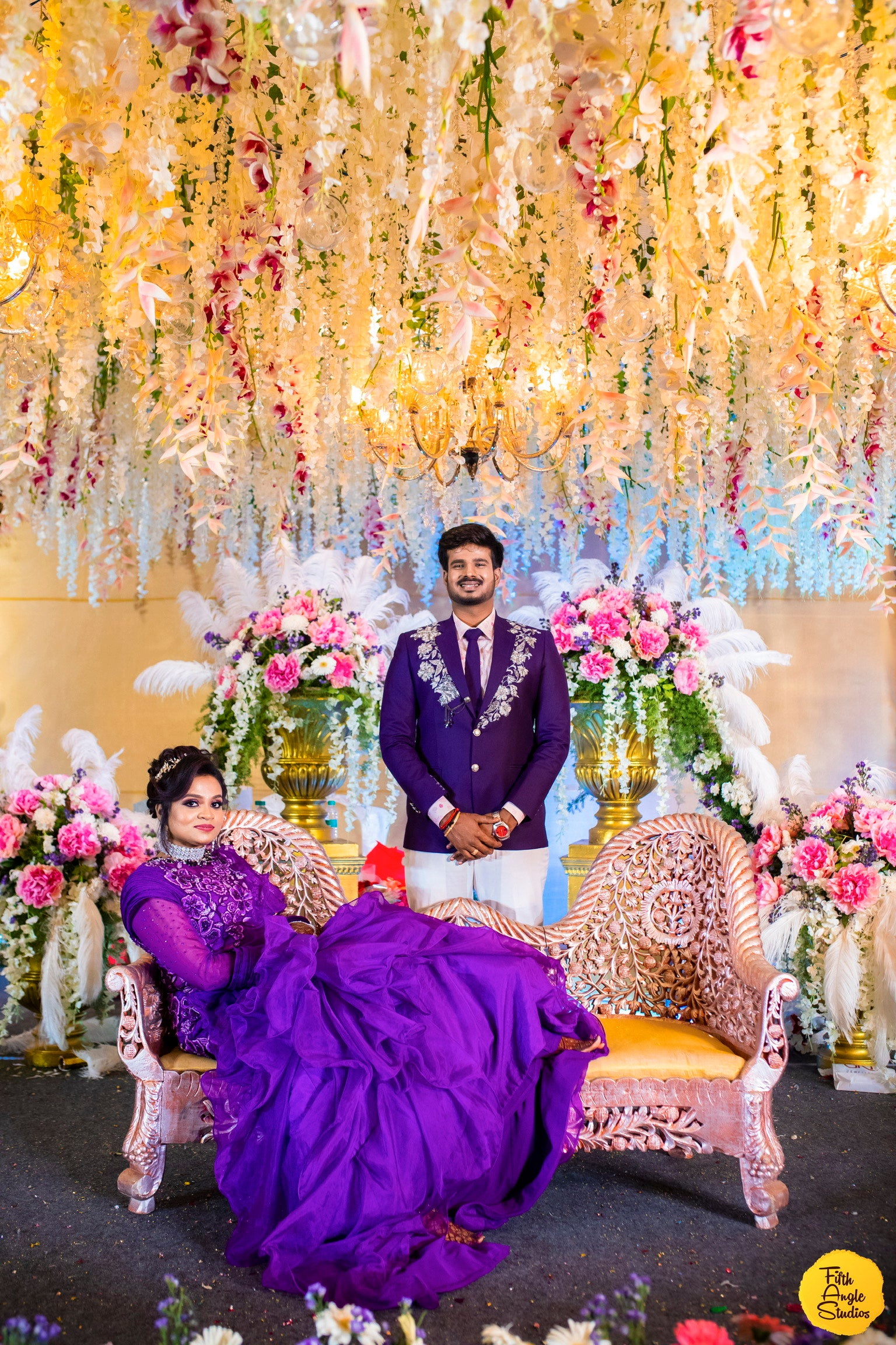 Bride Sai Sridevi & Groom in a purple gown and suit handcrafted by team Archana Karthick.