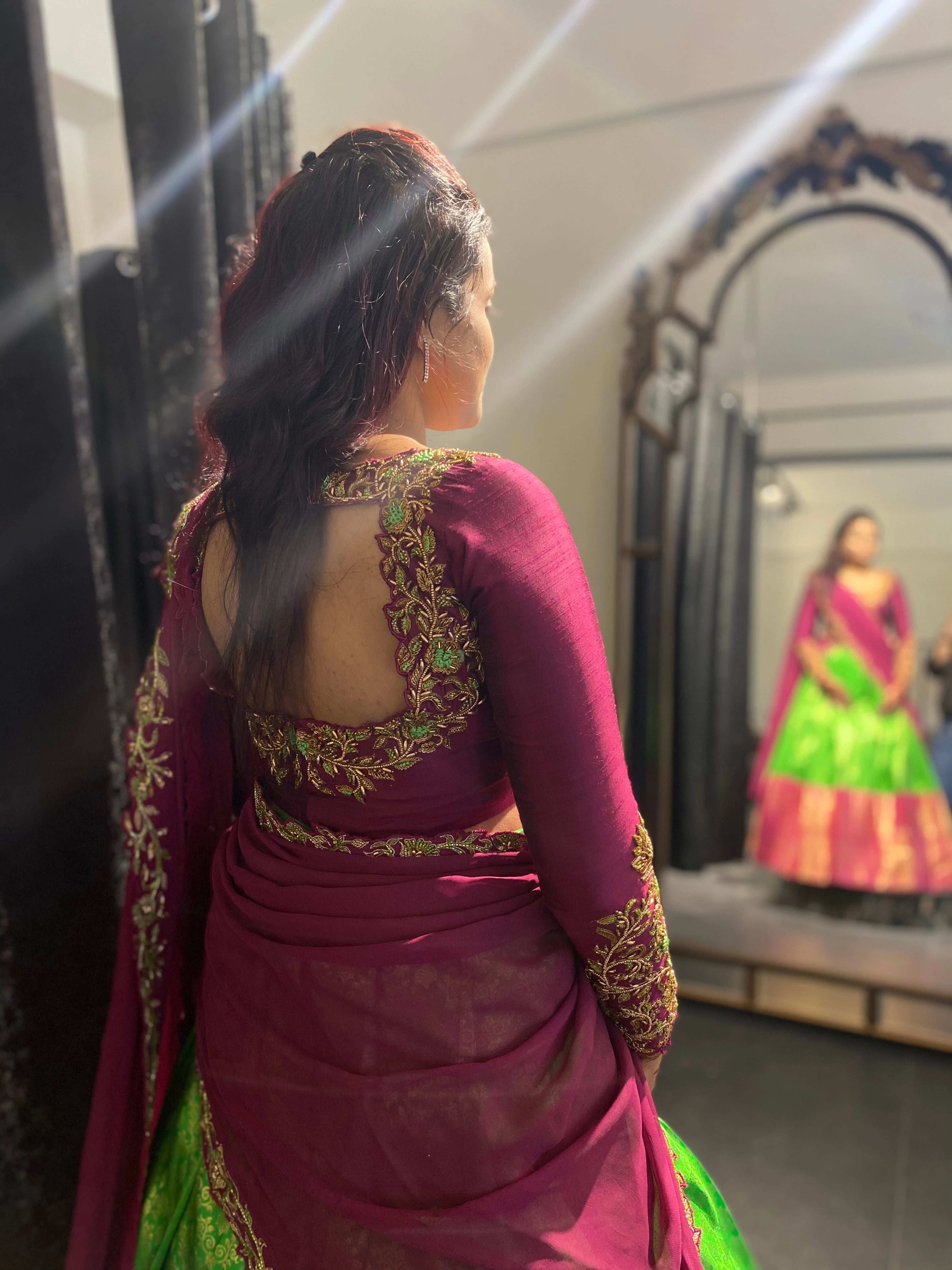 Bride Sai Sridevi during her fittings in a magenta and green half saree, handcrafted by team Archana Karthick.
