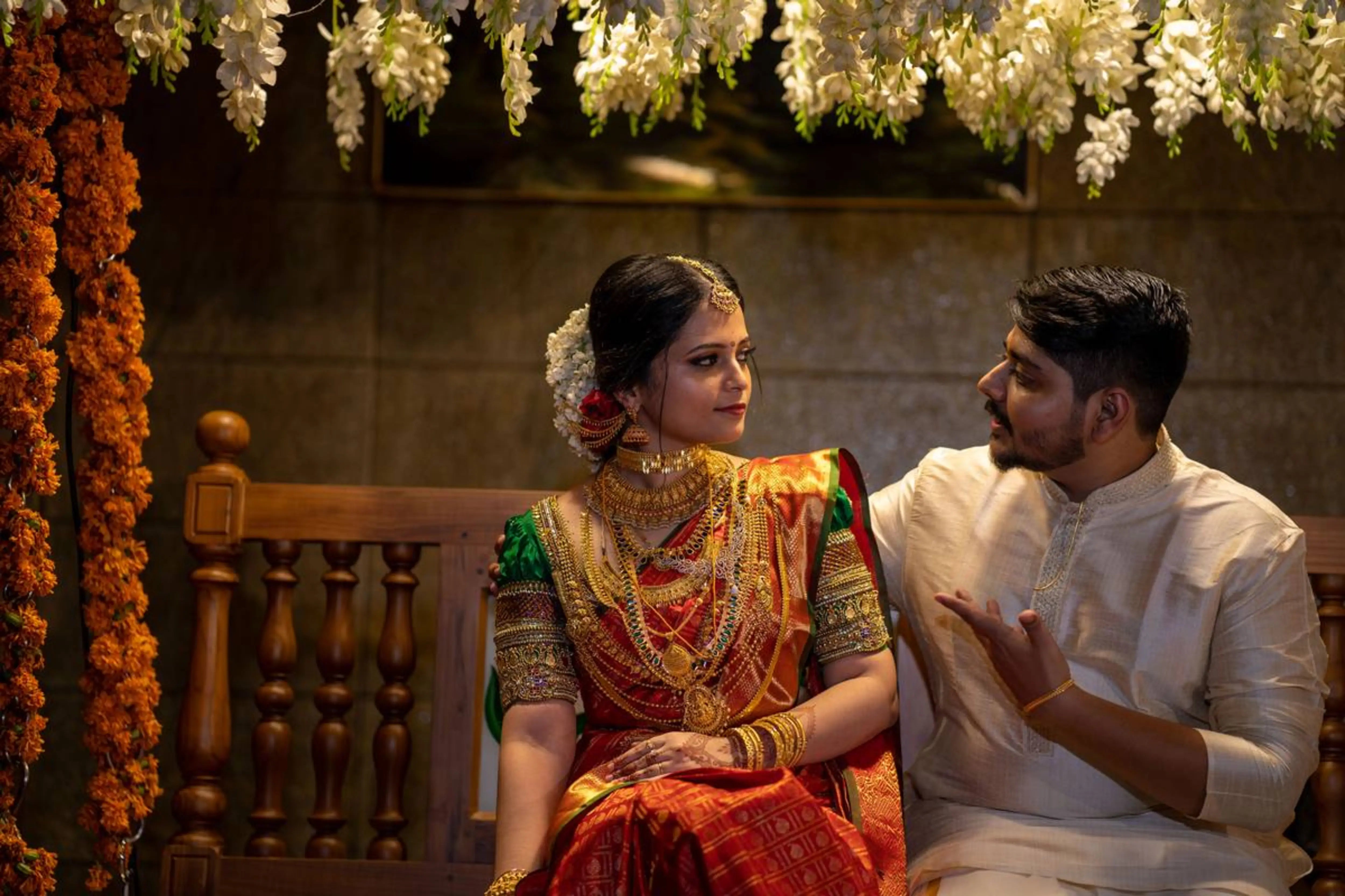 Bride Shalini from Kerala posing in a green silk blouse embellished by team Archana Karthick.