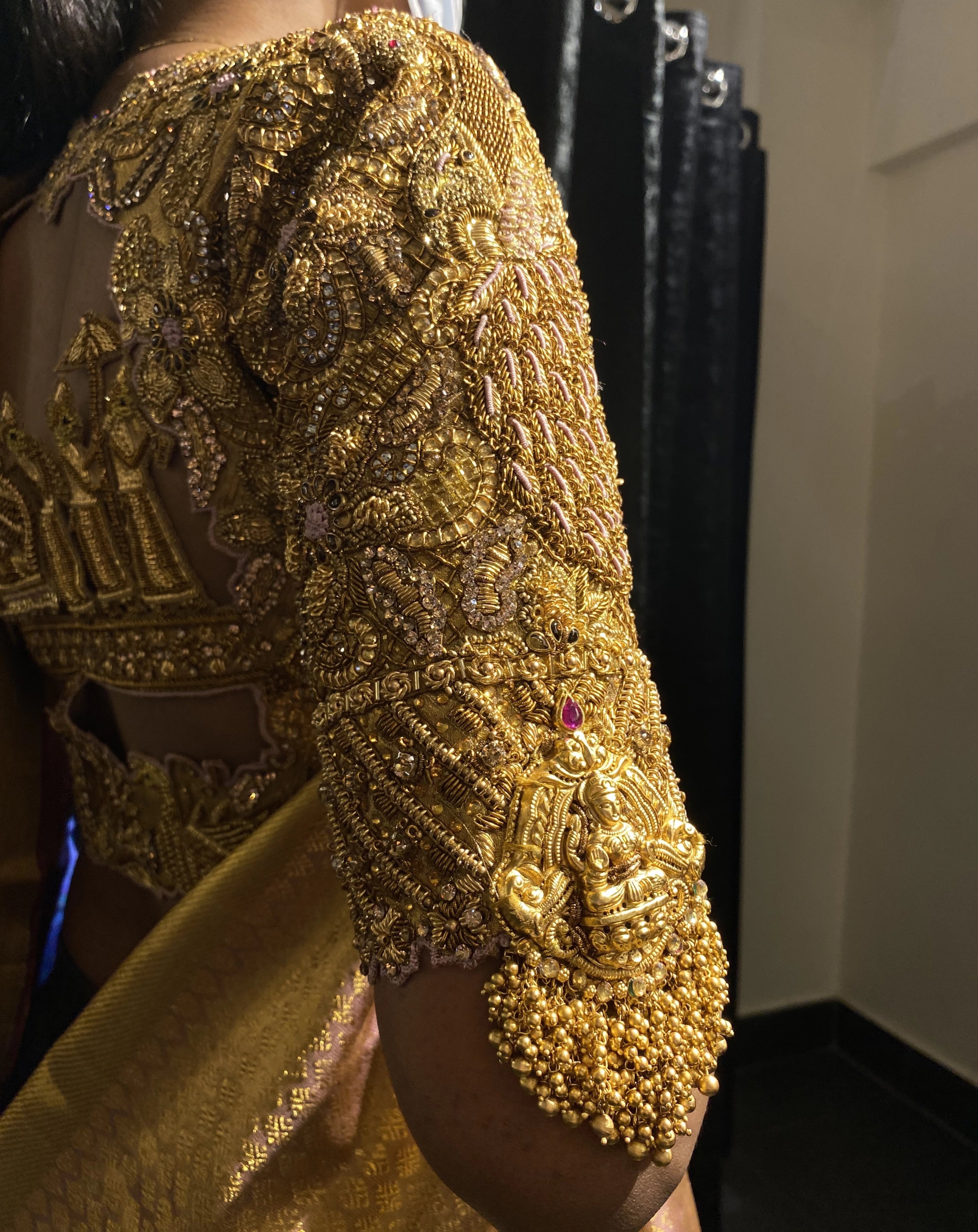 Bride Shanmugapriya during her fittings in a golden silk blouse by team Archana Karthick.