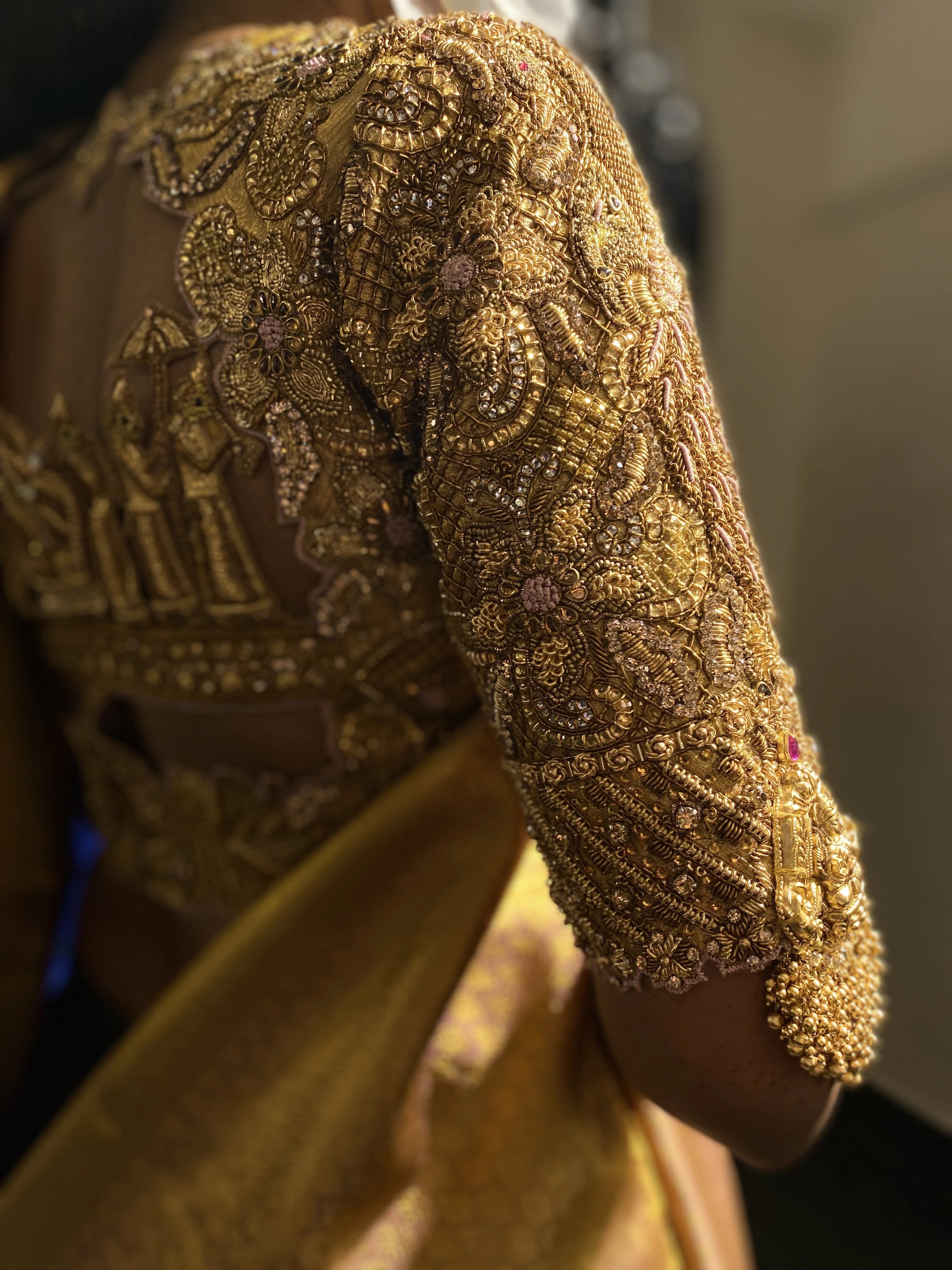 Bride Shanmugapriya for her wedding in a golden silk blouse by team Archana Karthick.