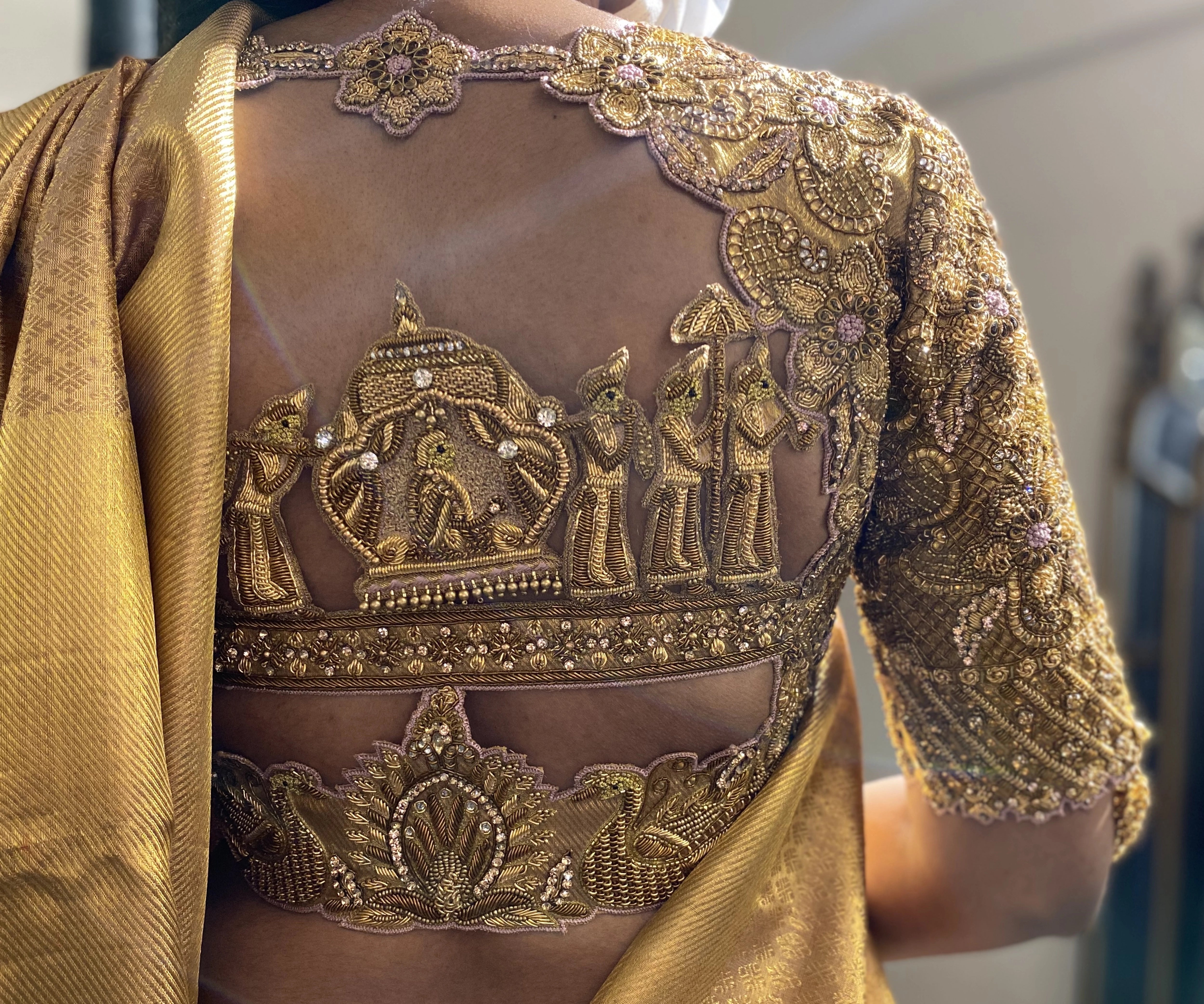 Bride Shanmugapriya in a golden silk blouse by team Archana Karthick.