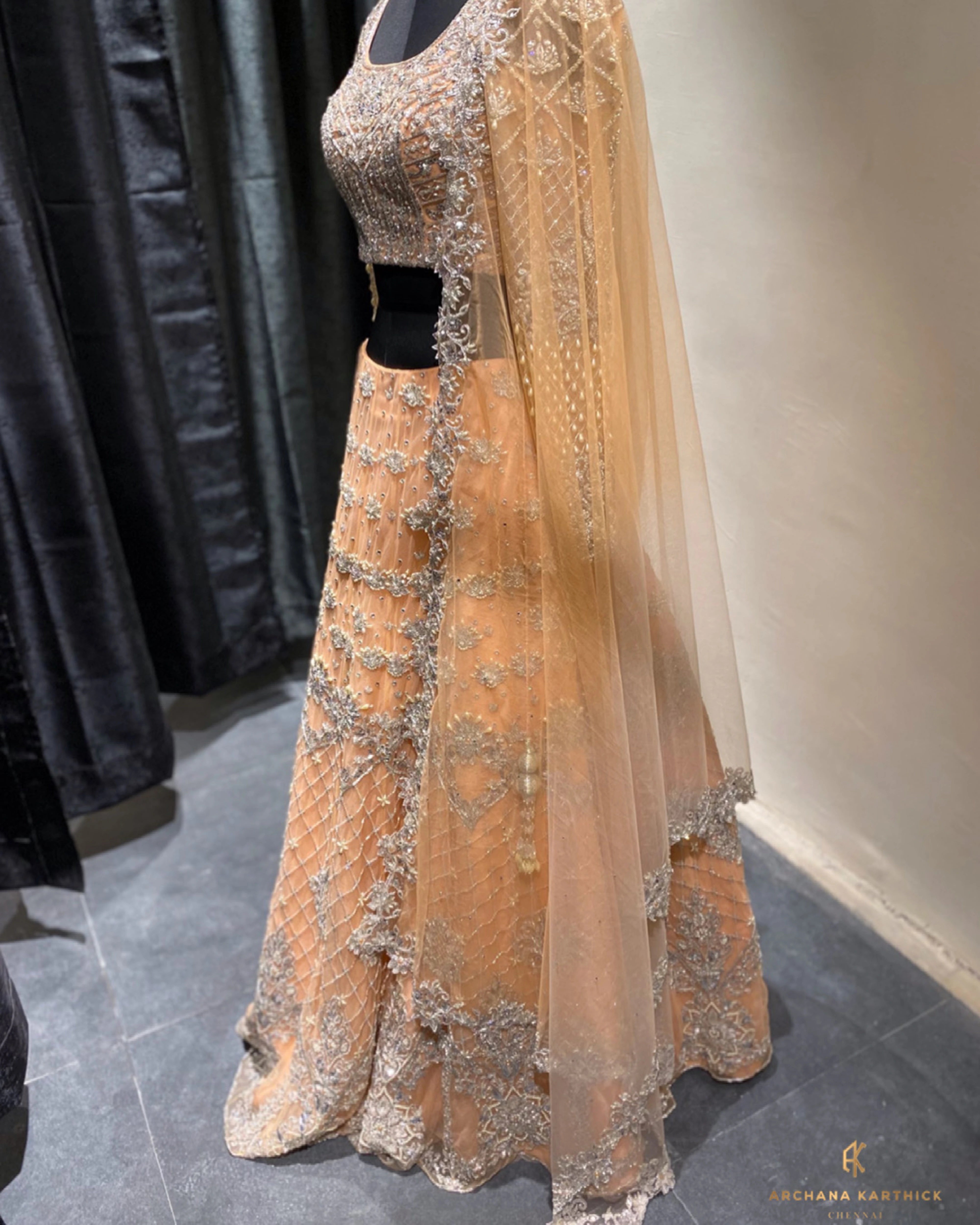 Bride Shanmugapriya's peach tulle reception lehenga, handcrafted by team Archana Karthick.