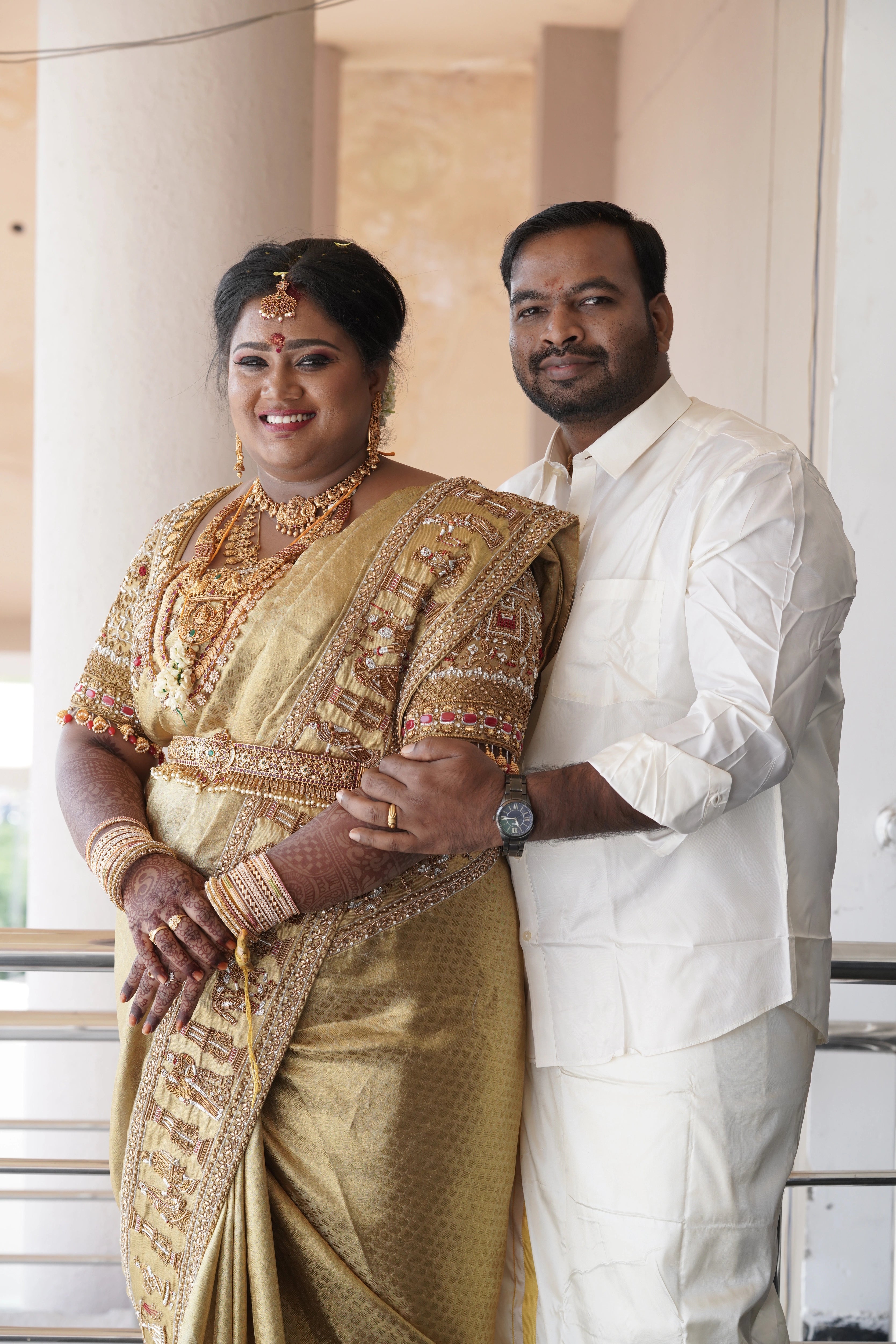 Bride Shyamaladevi in a gold palanquin concept silk blouse & saree border, intricately handcrafted with coins, jhumkas, zardozi etc by team Archana Karthick.