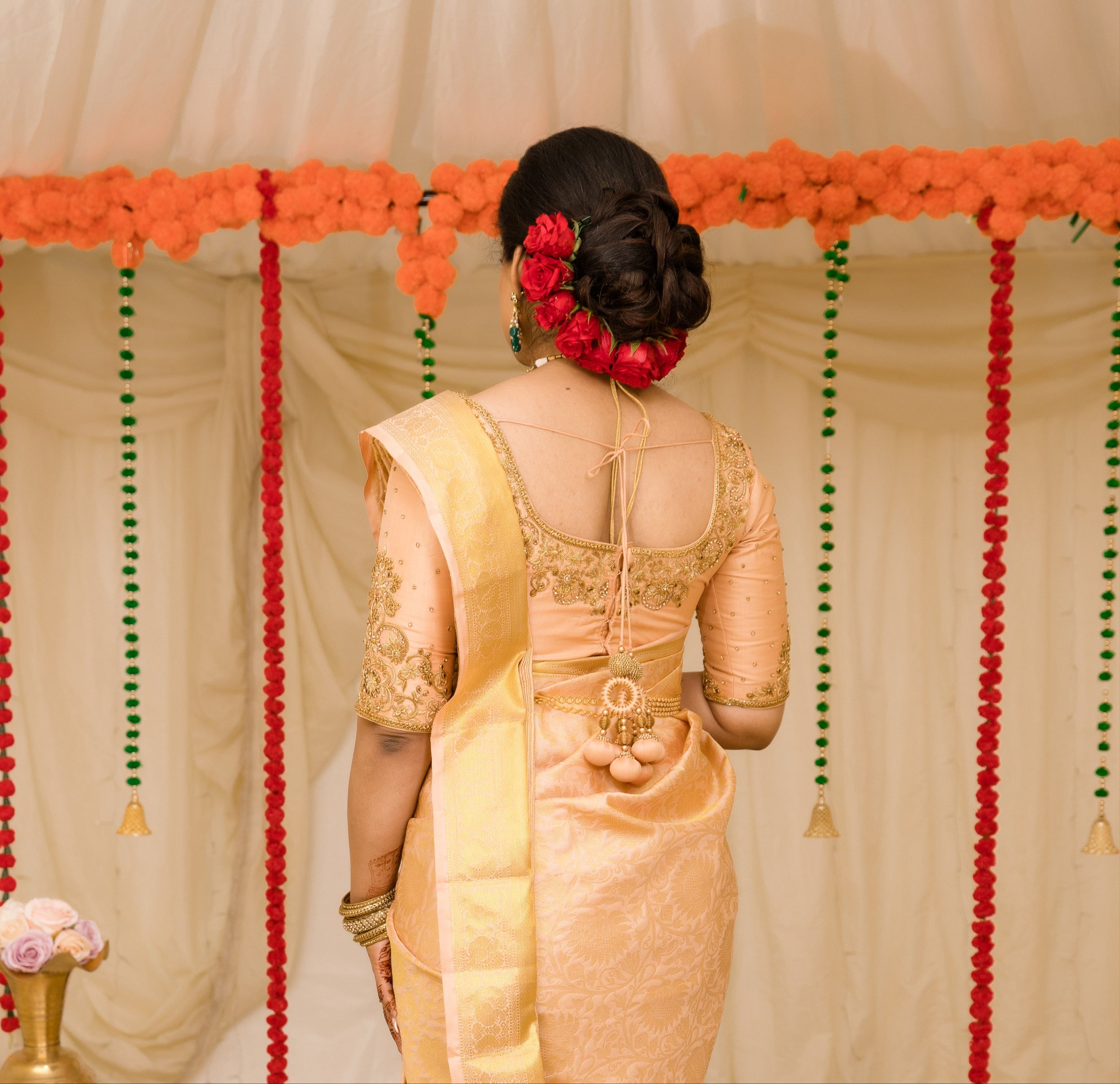 Bride Sinthuja from Middlesex, UK in a handcrafted silk blouse designed by Archana Karthick. Back design of blouse captured.