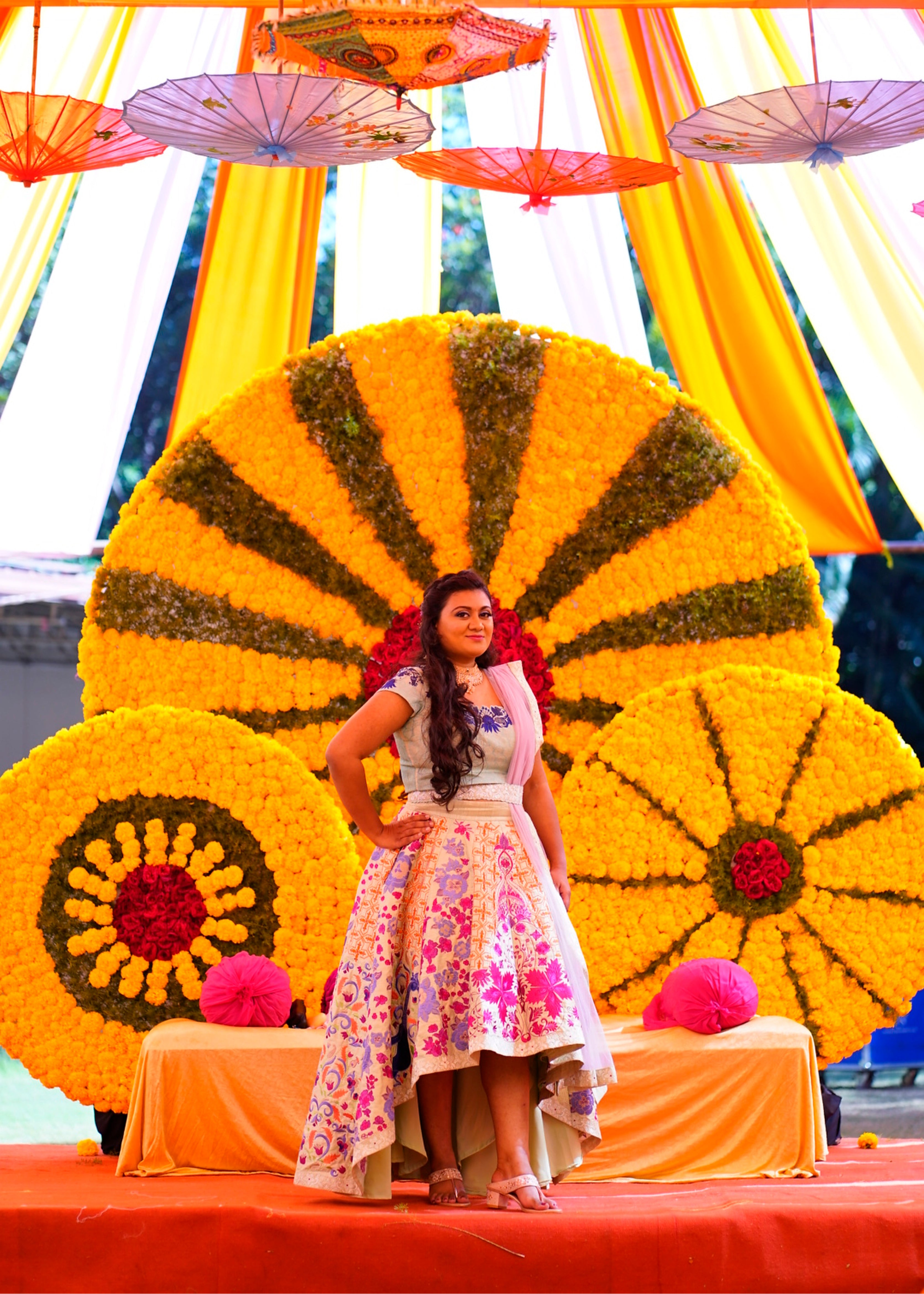 Bride Sowmya Rani from Hyderabad smiling in a pastel pistachio green lehenga handcrafted by team Archana Karthick.