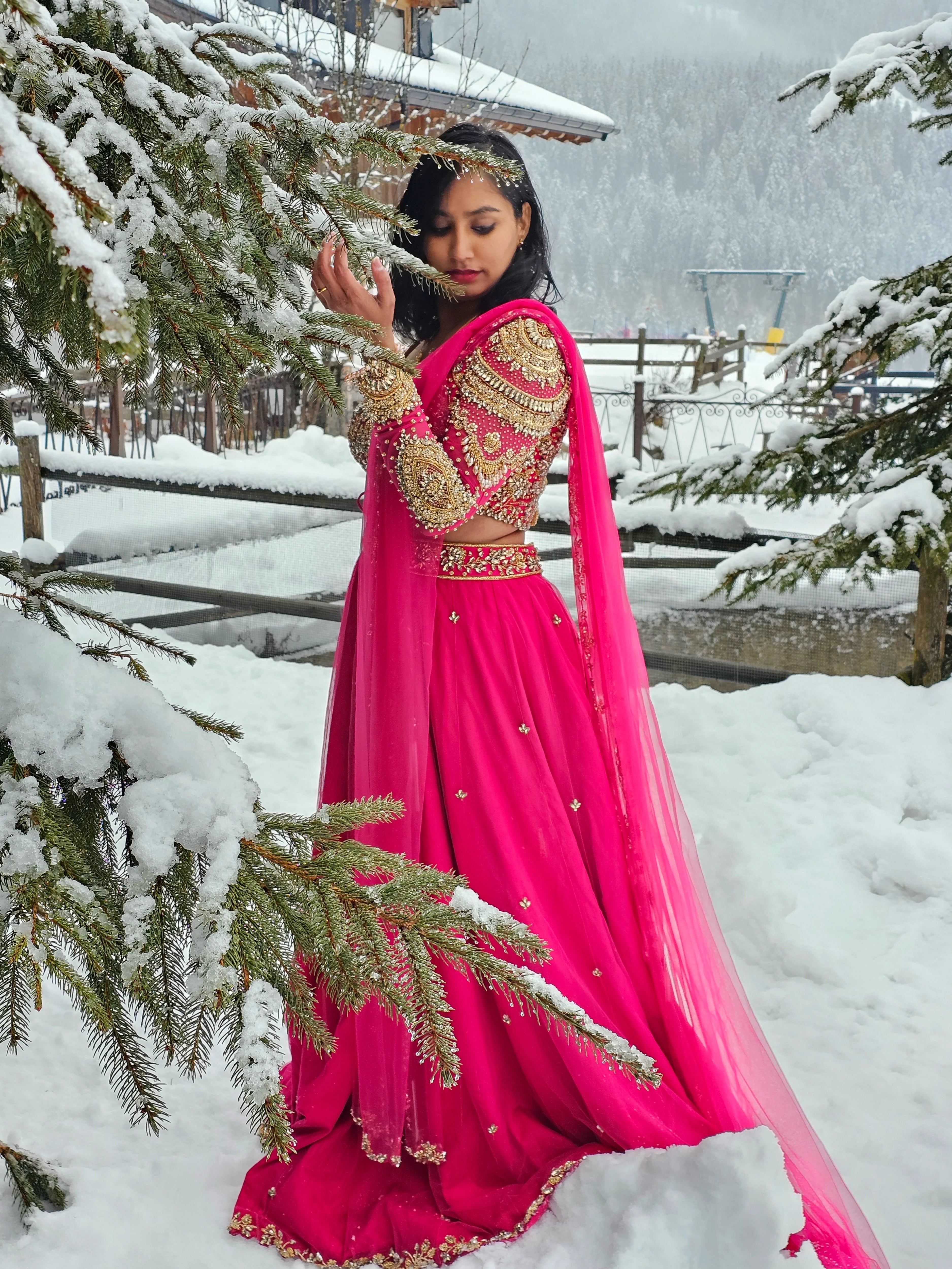 Bride Steffy from Italy in a pink tulle reception lehenga by team Archana Karthick.