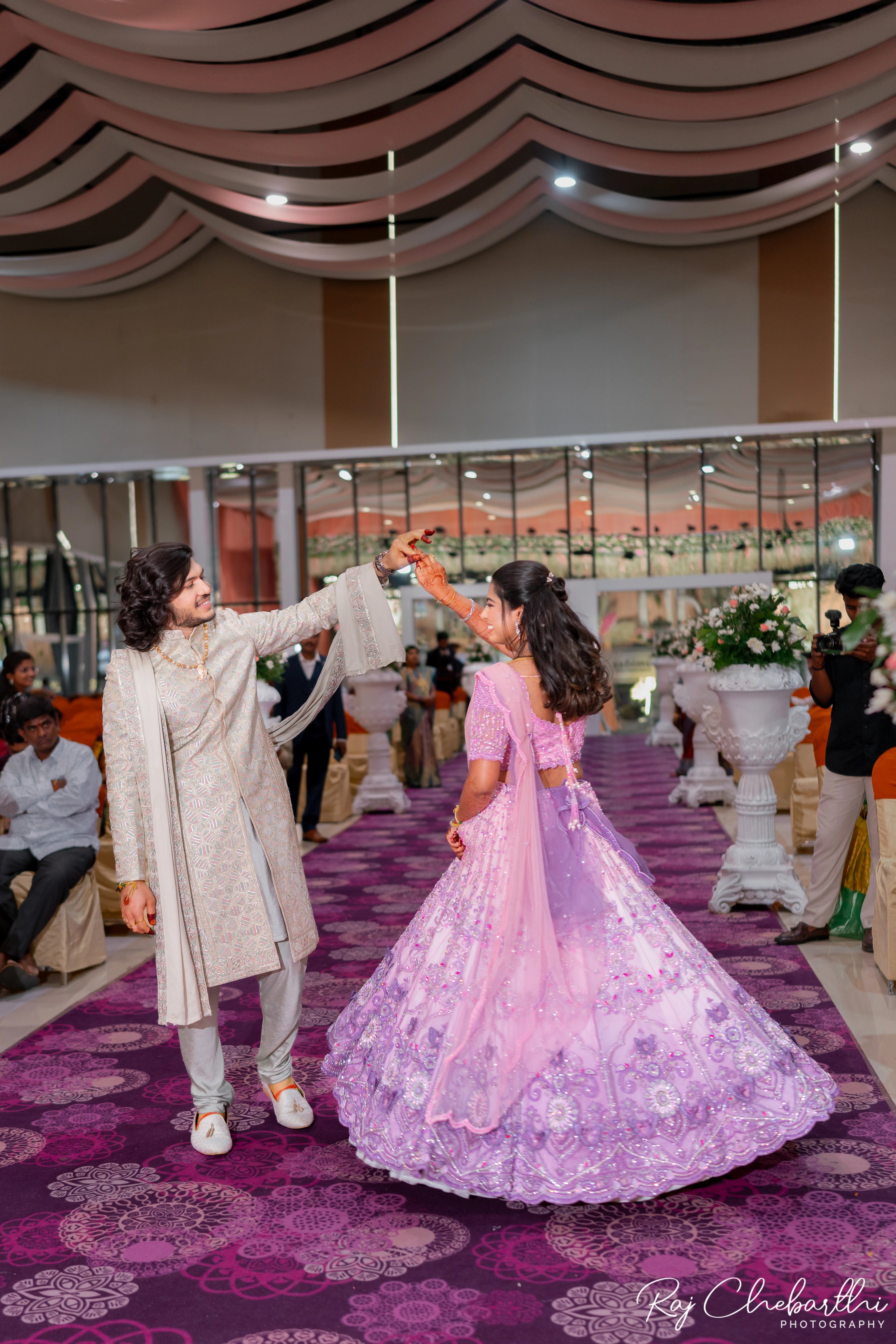 Bride Subhiksha from US twirling in a lavender-pink lehenga by Archana Karthick