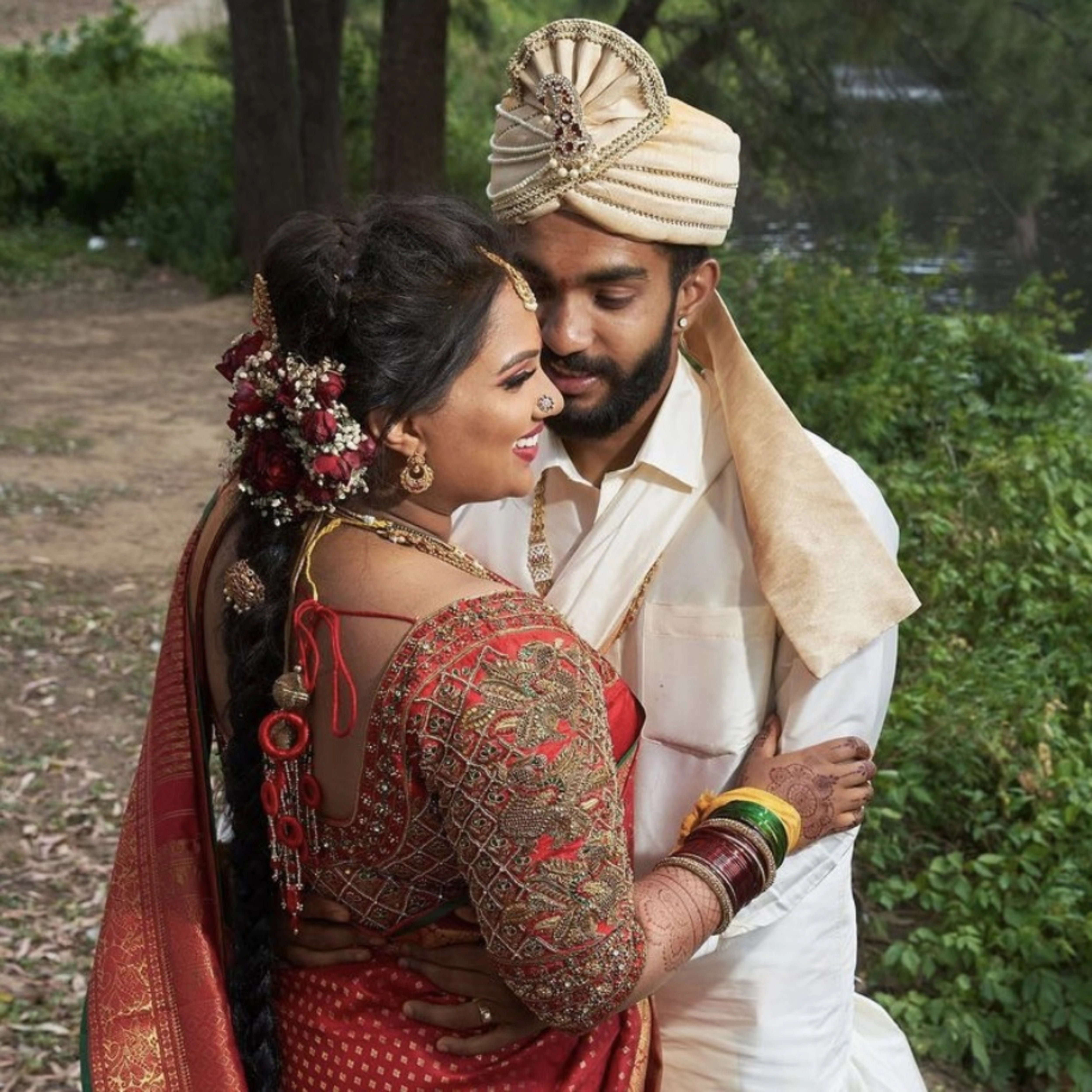 Bride Thena from Australia smiling in a red silk blouse by Archana Karthick