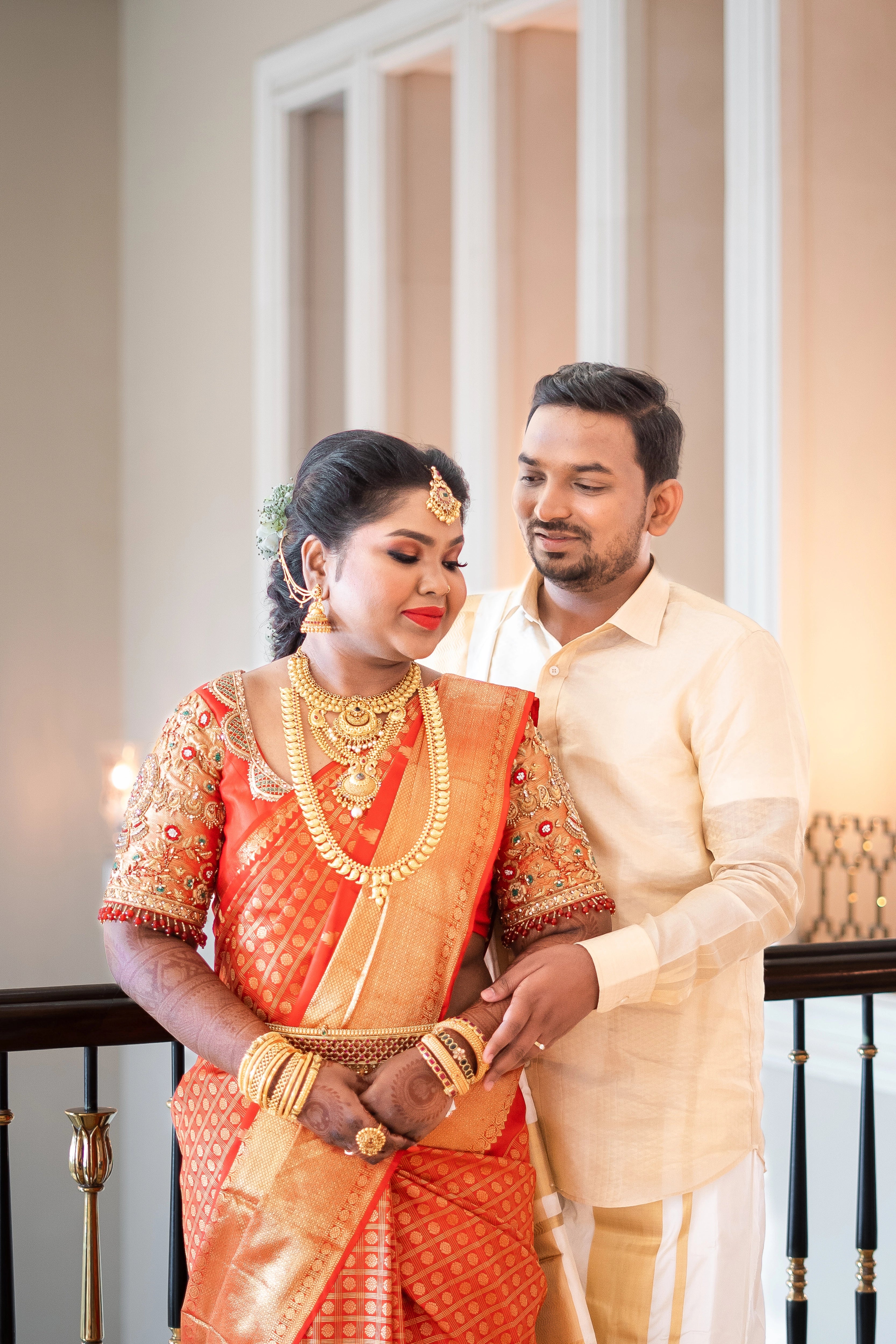 Bride Vanmathi from Chennai in a red and gold silk blouse for her wedding, handcrafted with zardozi, stones, kundan, beads and resham by team Archana Karthick.
