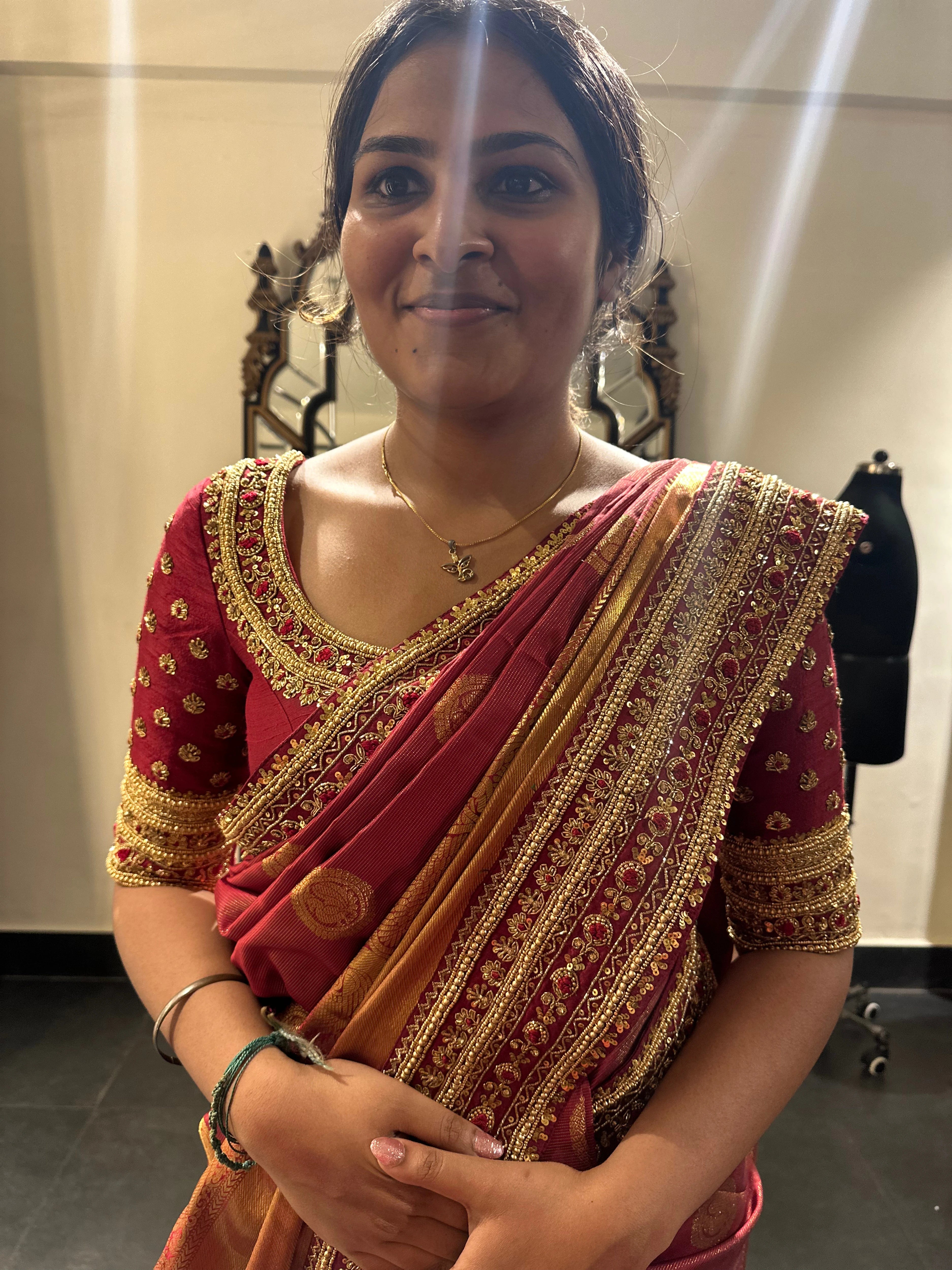 Bride Vidhyashree Ravi during her fittings in a maroon silk blouse and saree border handcrafted by team Archana Karthick.