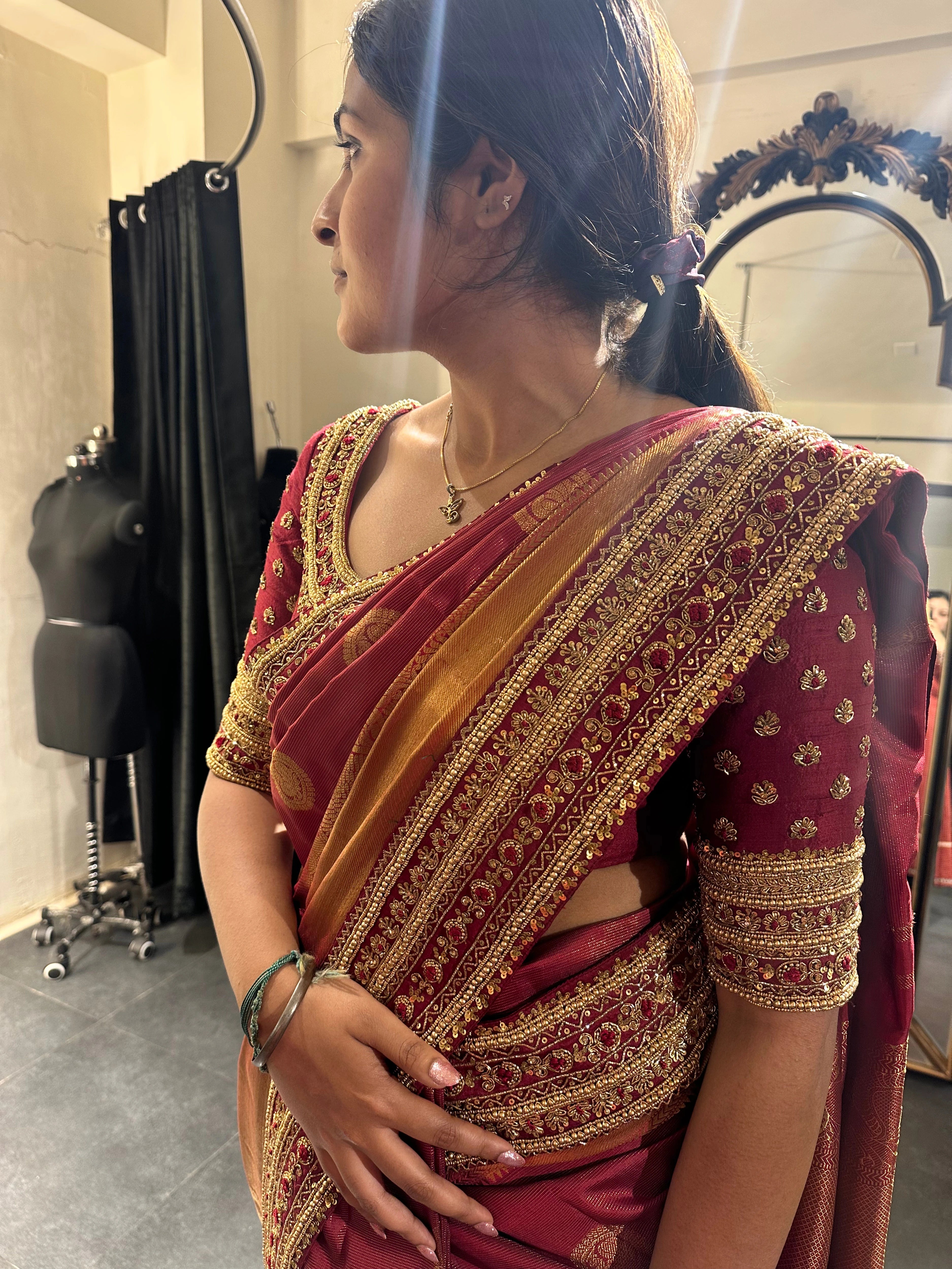 Bride Vidhyashree Ravi in a maroon silk blouse and saree border handcrafted by team Archana Karthick.