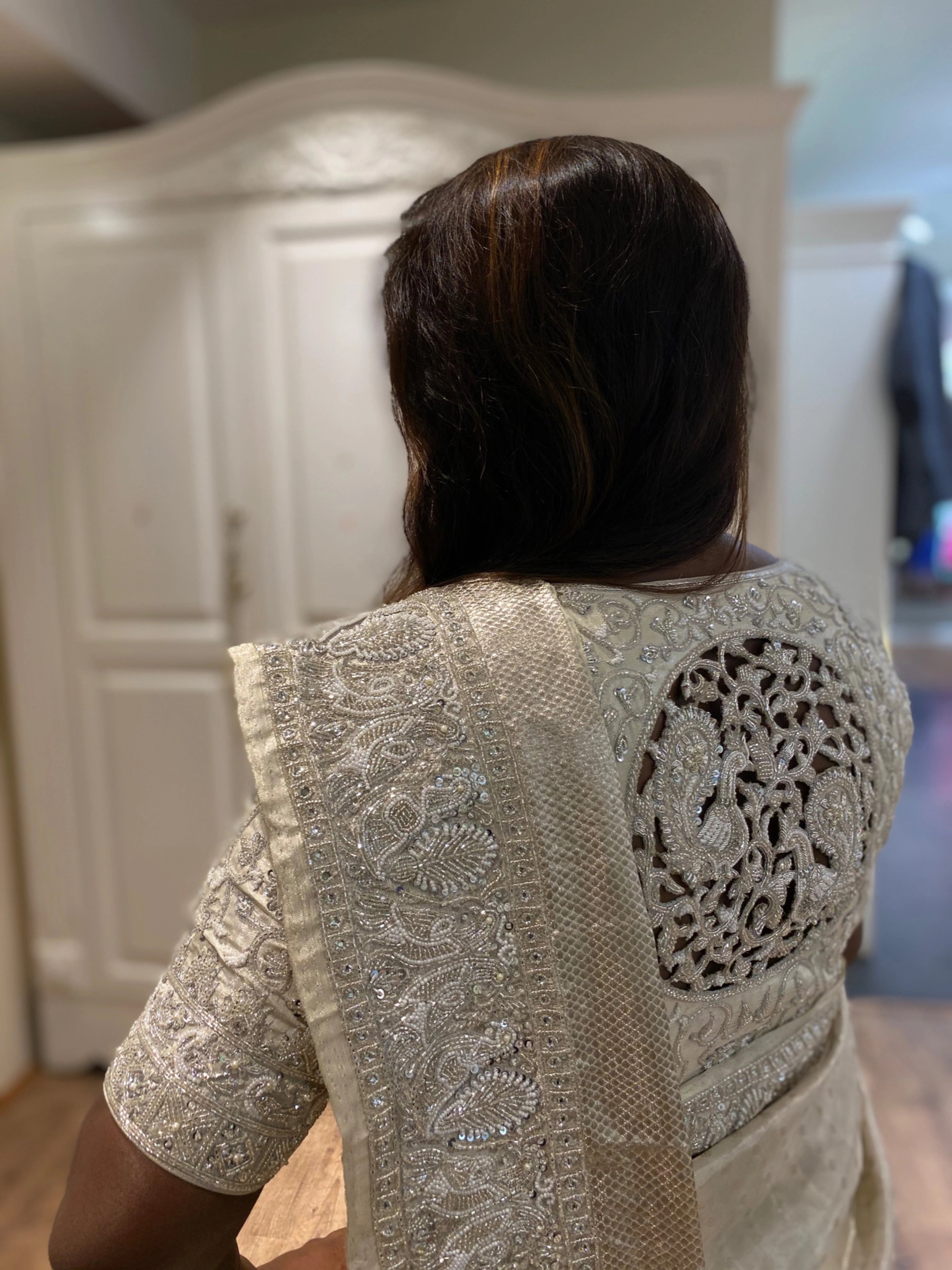 Bride Viniba from Chennai posing in an ivory and silver silk blouse and saree border handcrafted intricately with beads, stones, sequins, cutdana and zardozi.