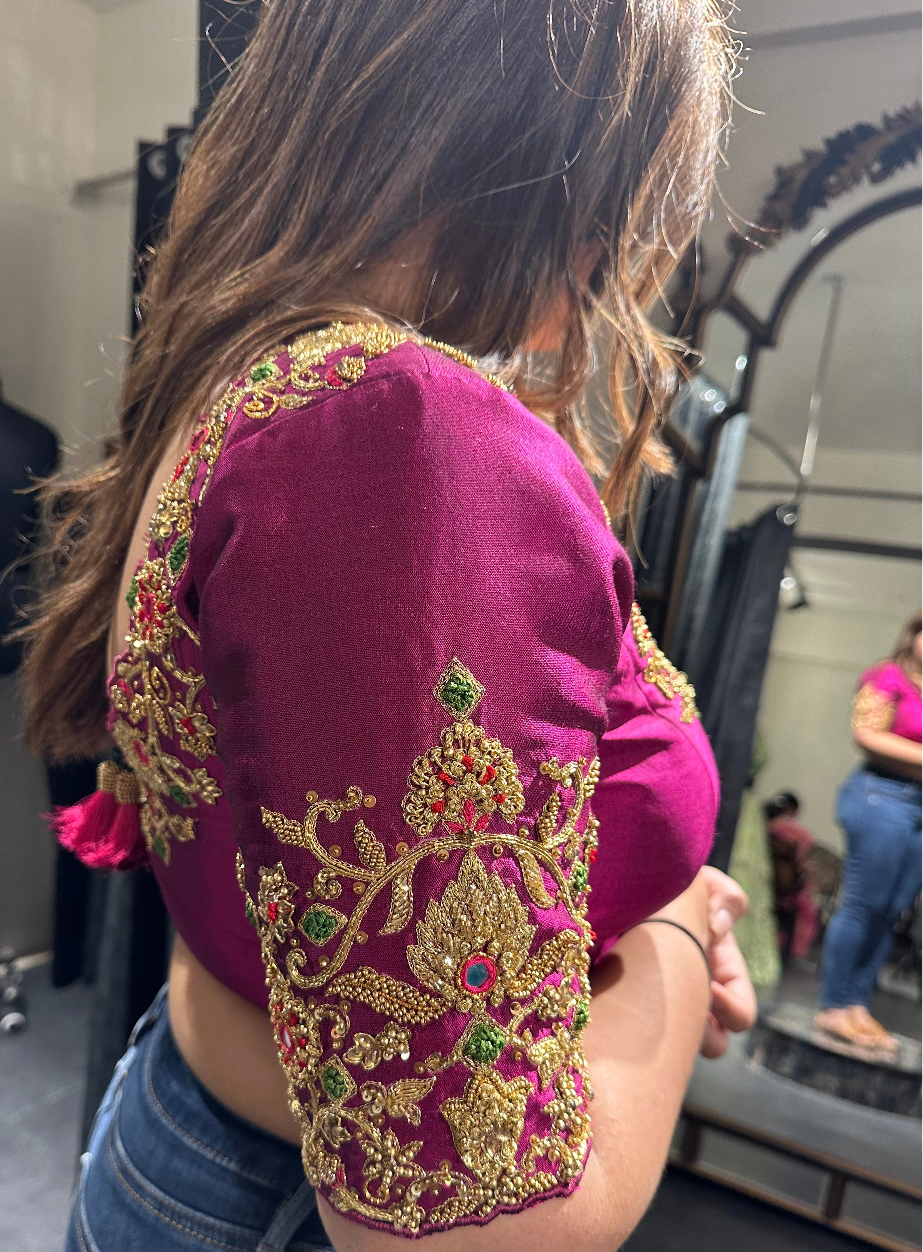 Bride Visali from USA during fittings in a magenta raw silk blouse handcrafted by team Archana Karthick.