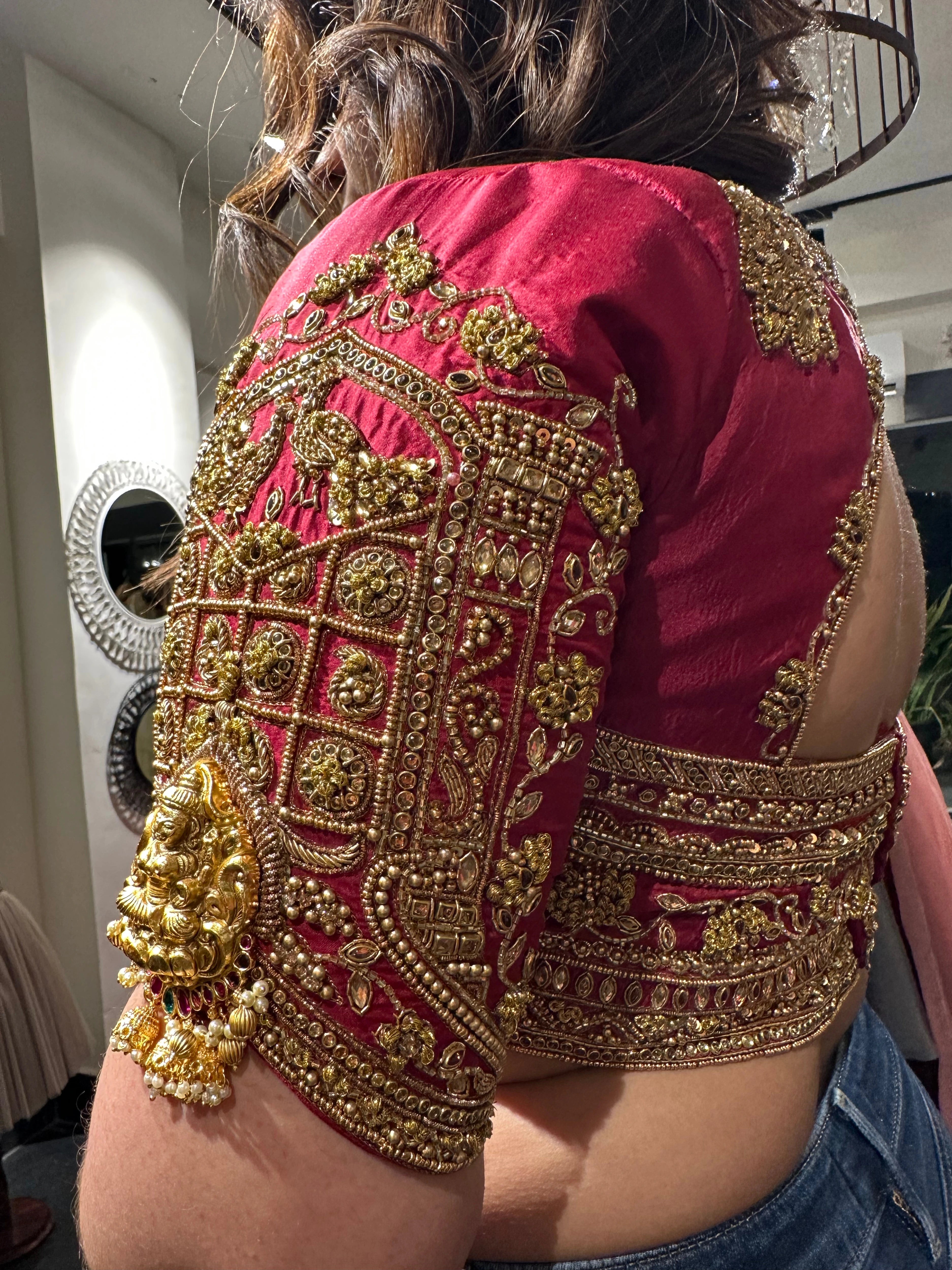 Bride Visali from USA during her fittings in a red raw silk blouse handcrafted by team Archana Karthick.