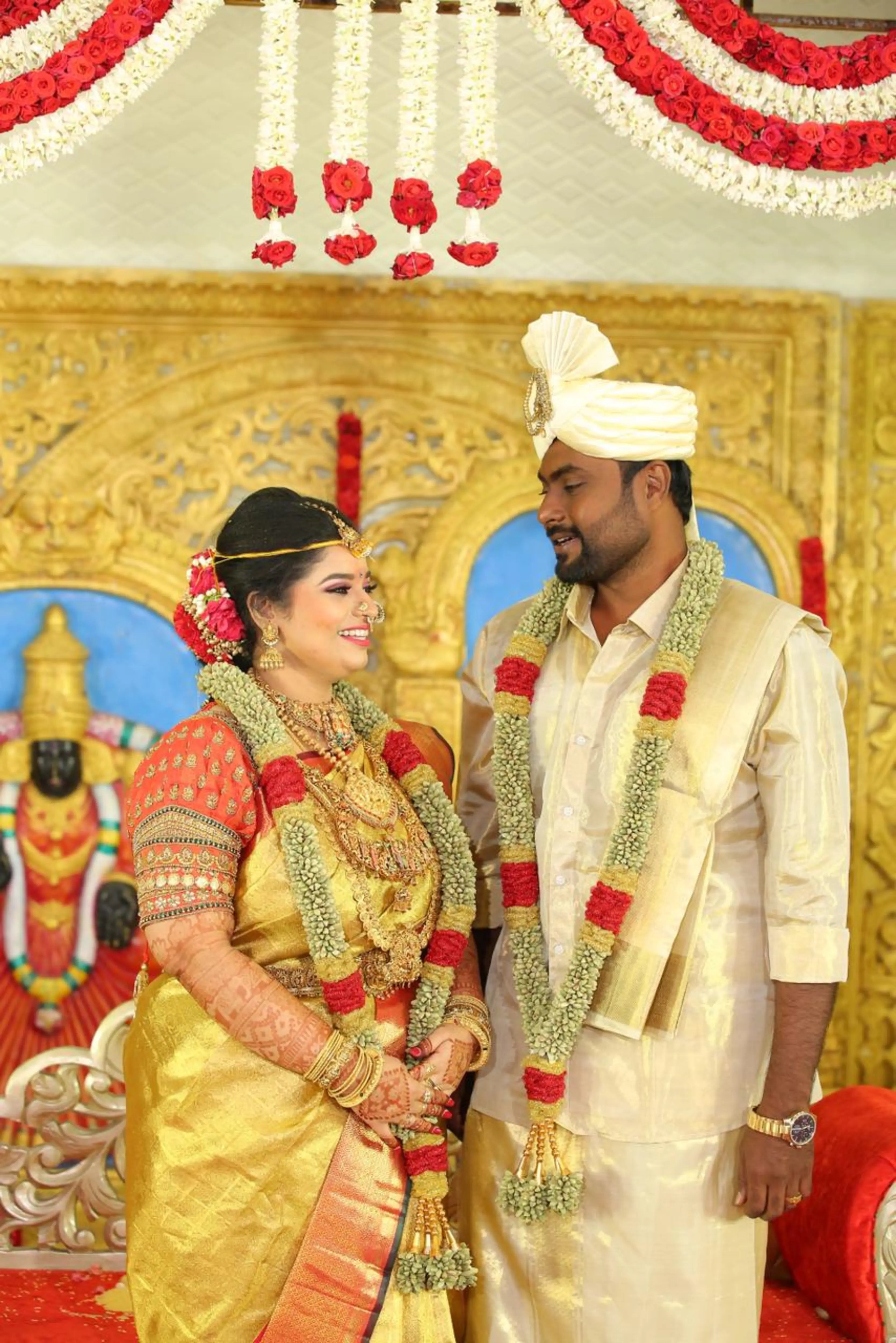 Bride Vishnulakshmi in a concept burnt orange puff sleeved silk blouse, handcrafted with beads, zardozi, kundan, resham and stones by team Archana Karthick.