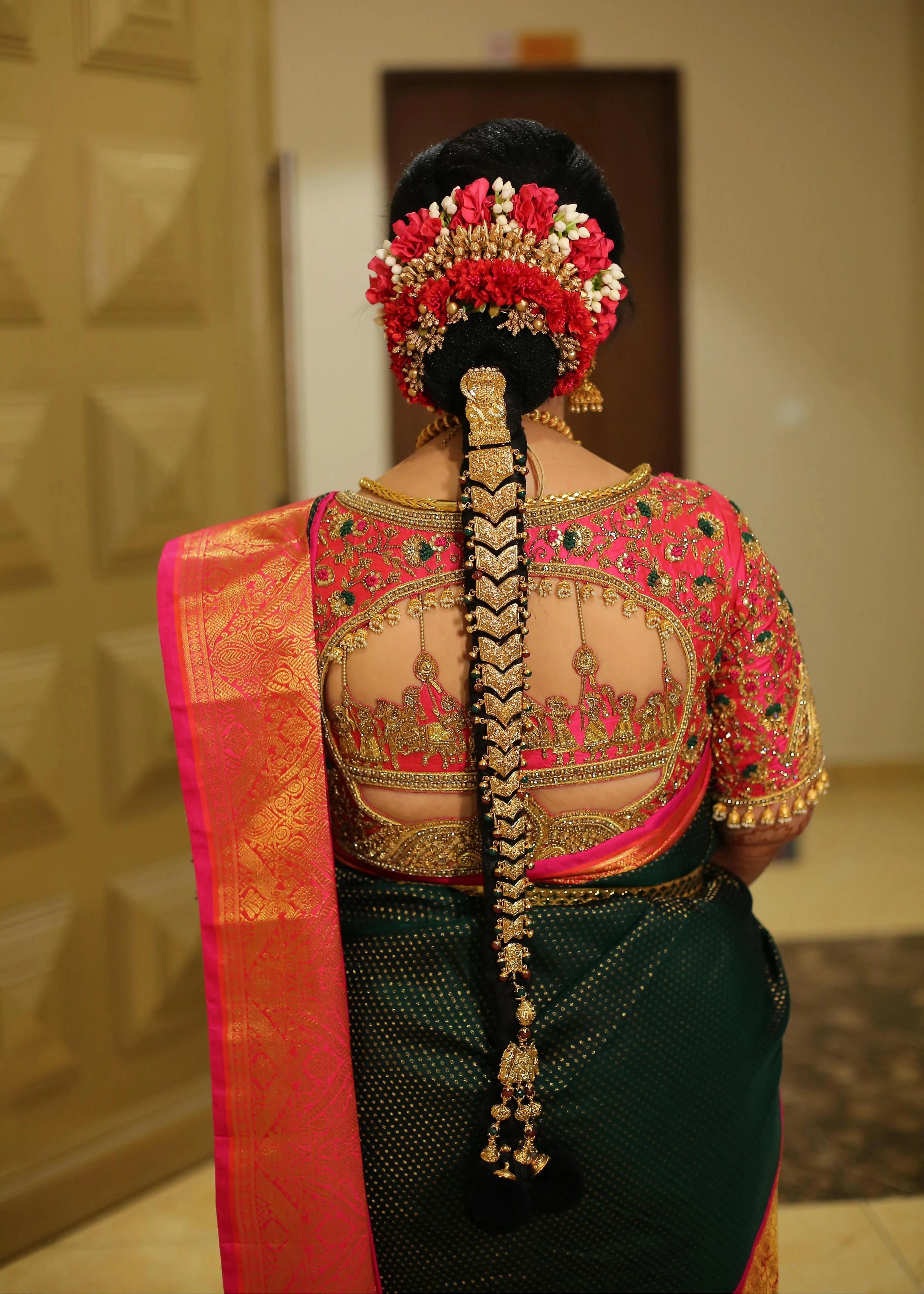 Bride Vishnulakshmi in a palanquin concept hot pink silk blouse, handcrafted with beads, zardozi, kundan, resham and stones by team Archana Karthick.