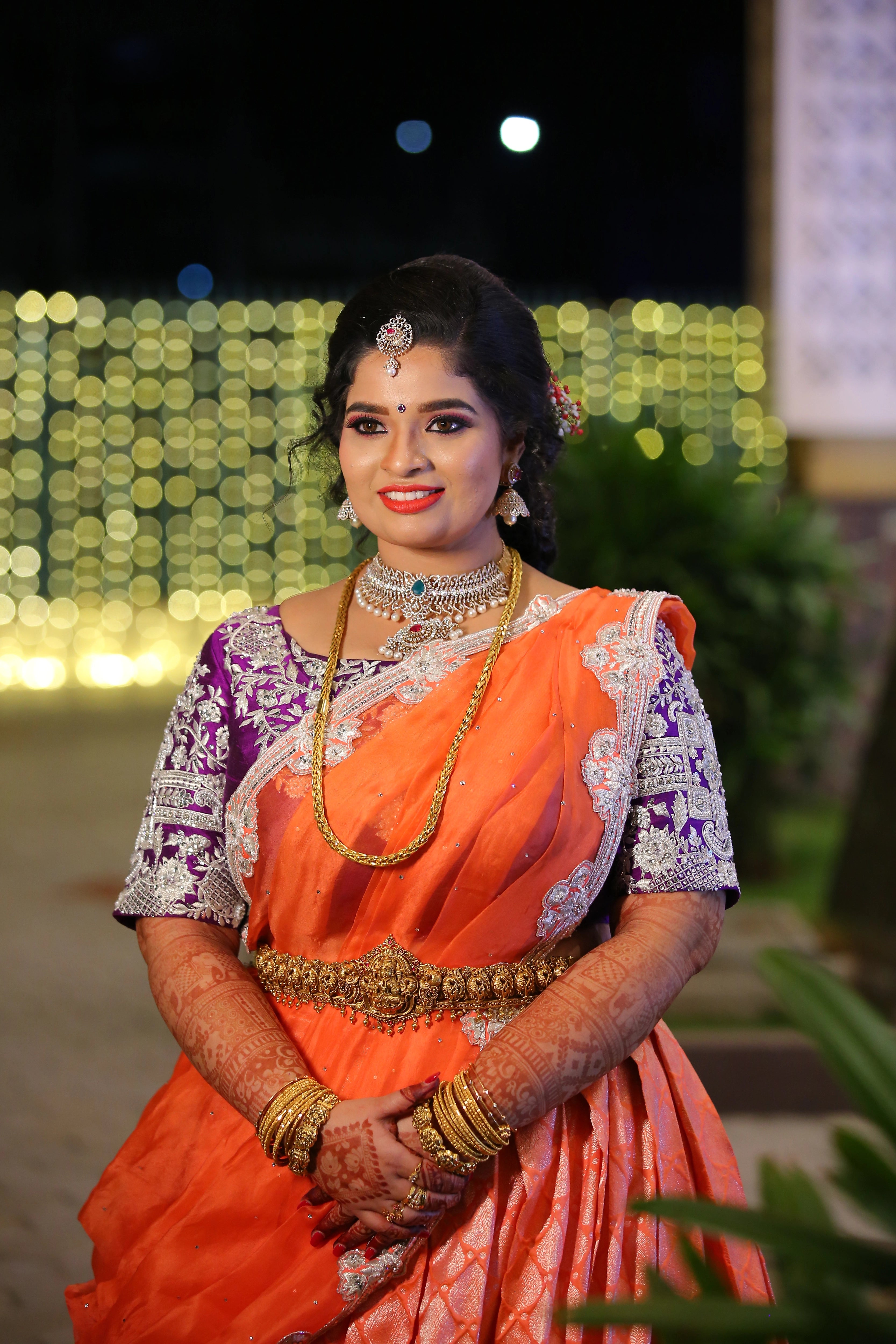 Bride Vishnulakshmi in a purple raw silk blouse and saree border, handcrafted with beads, zari, stones, pearls and sequins by team Archana Karthick.