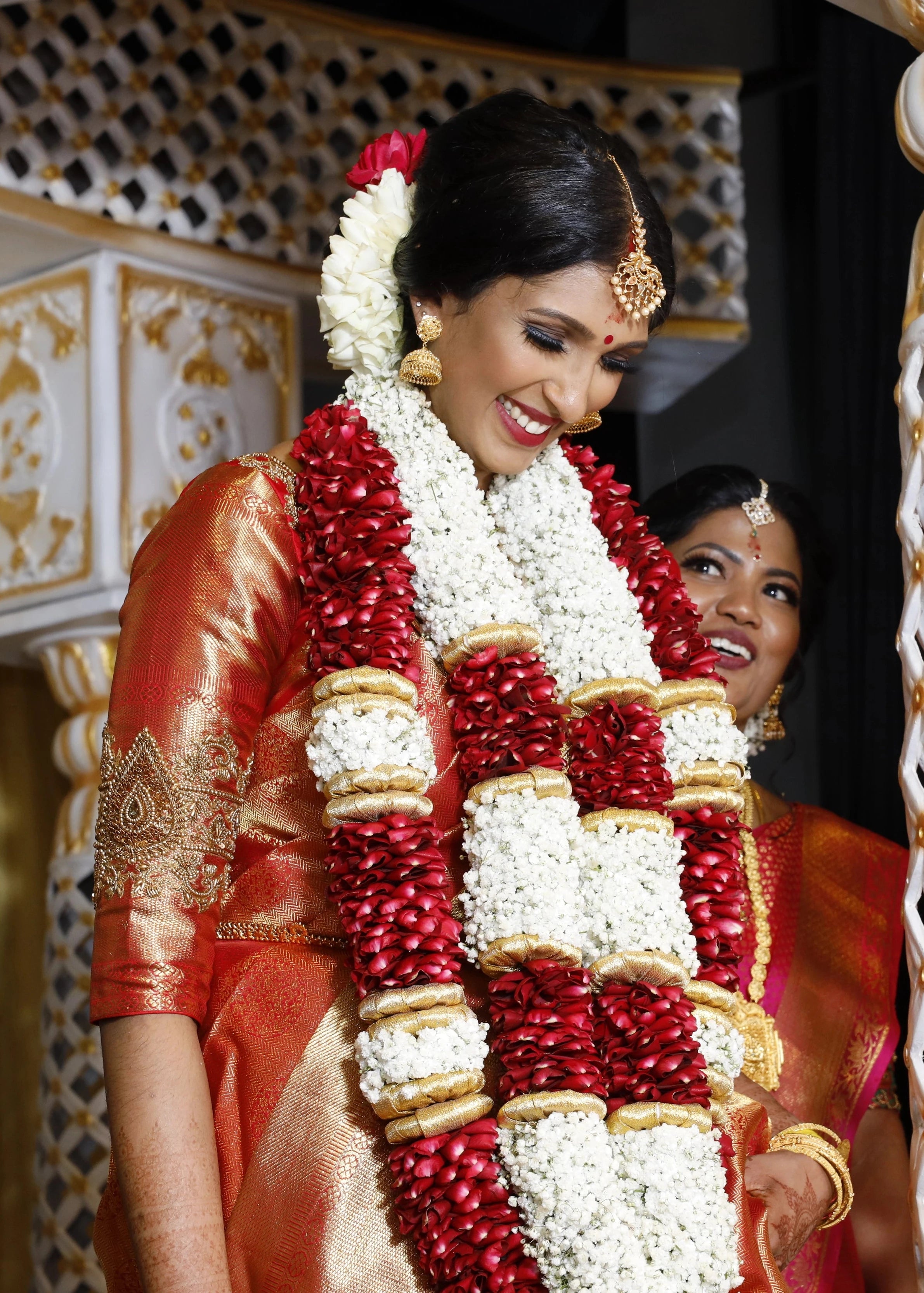 Bride Vithusika from Switzerland in a red silk concept blouse for her wedding, handcrafted with zardozi, beads, sequins and cutdana by team Archana Karthick.