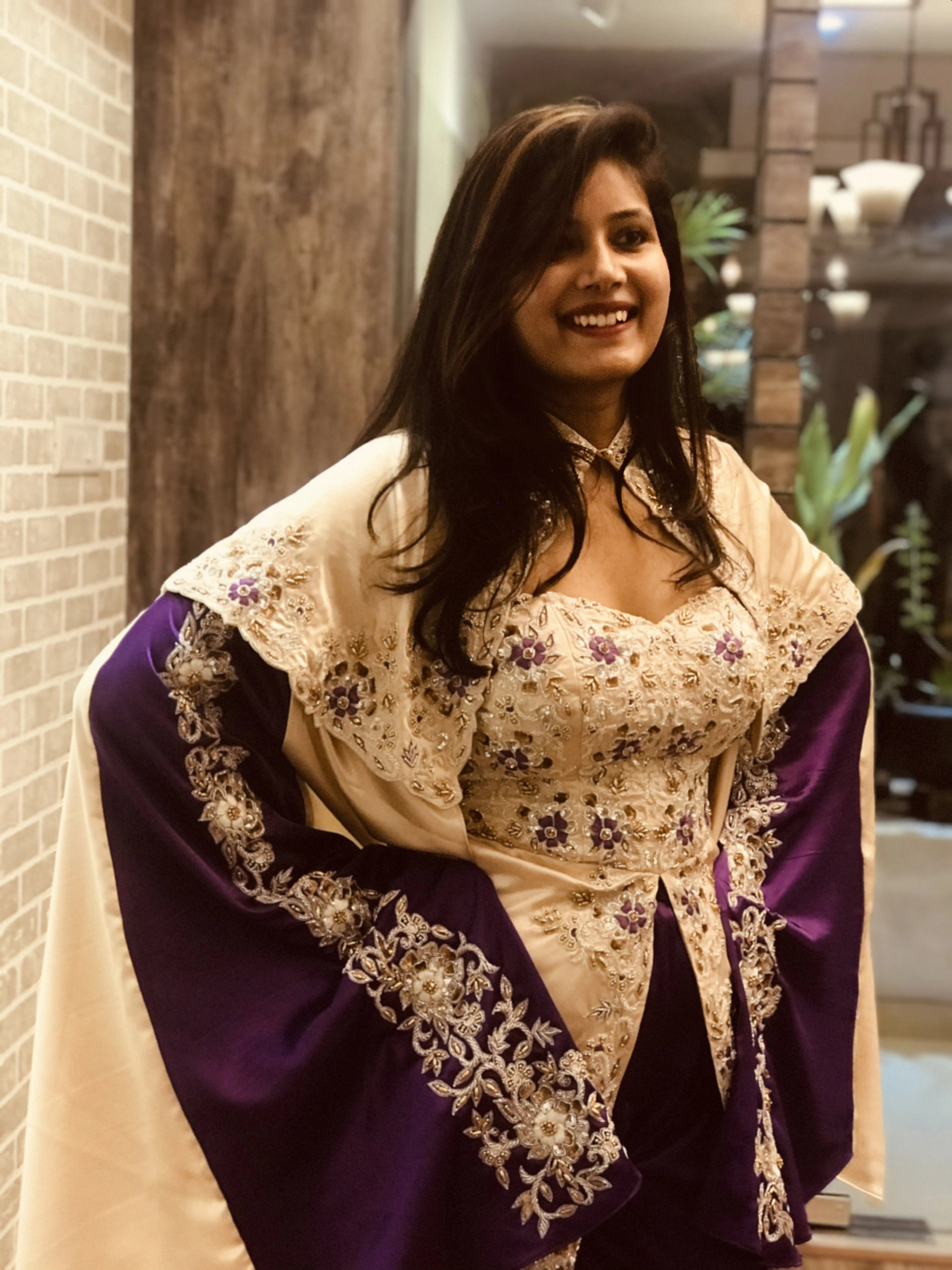 Bride during her fittings in a handcrafted satin silk corset outfit (corset x masakali x kimono fusion) embellished with cut dana, sequins, beads and resham embellishments. Posing for her sangeet party.