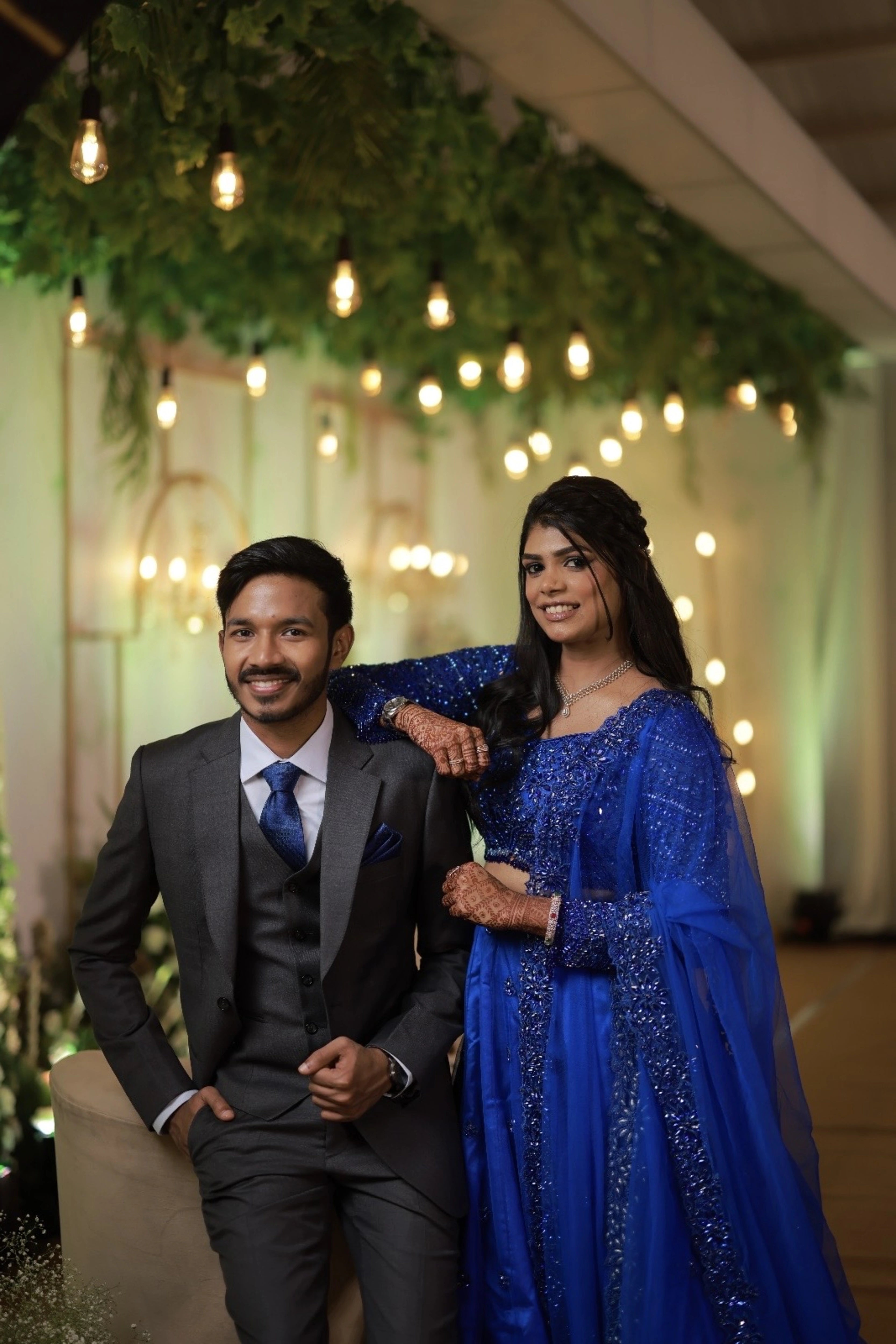 Bride Snegha from Australia posing for photo in a blue tulle lehenga, handcrafted with sequins, cutdana, rhinestones and crystals by team Archana Karthick.