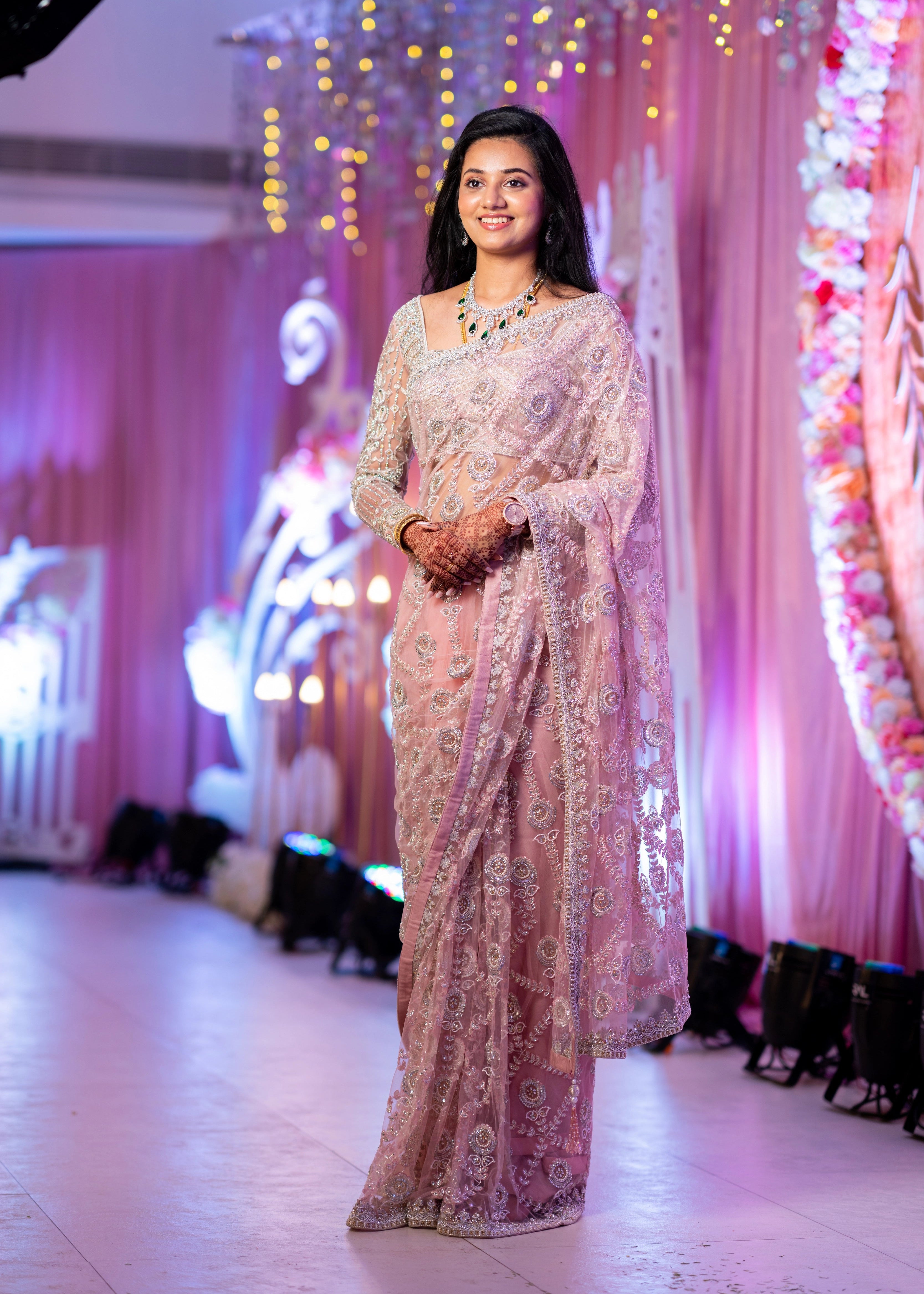 Bride from Berlin on stage in a concept pink tulle saree designed by Archana Karthick handcrafted with stones, crystal beads, cutdanas, resham work and sequins.