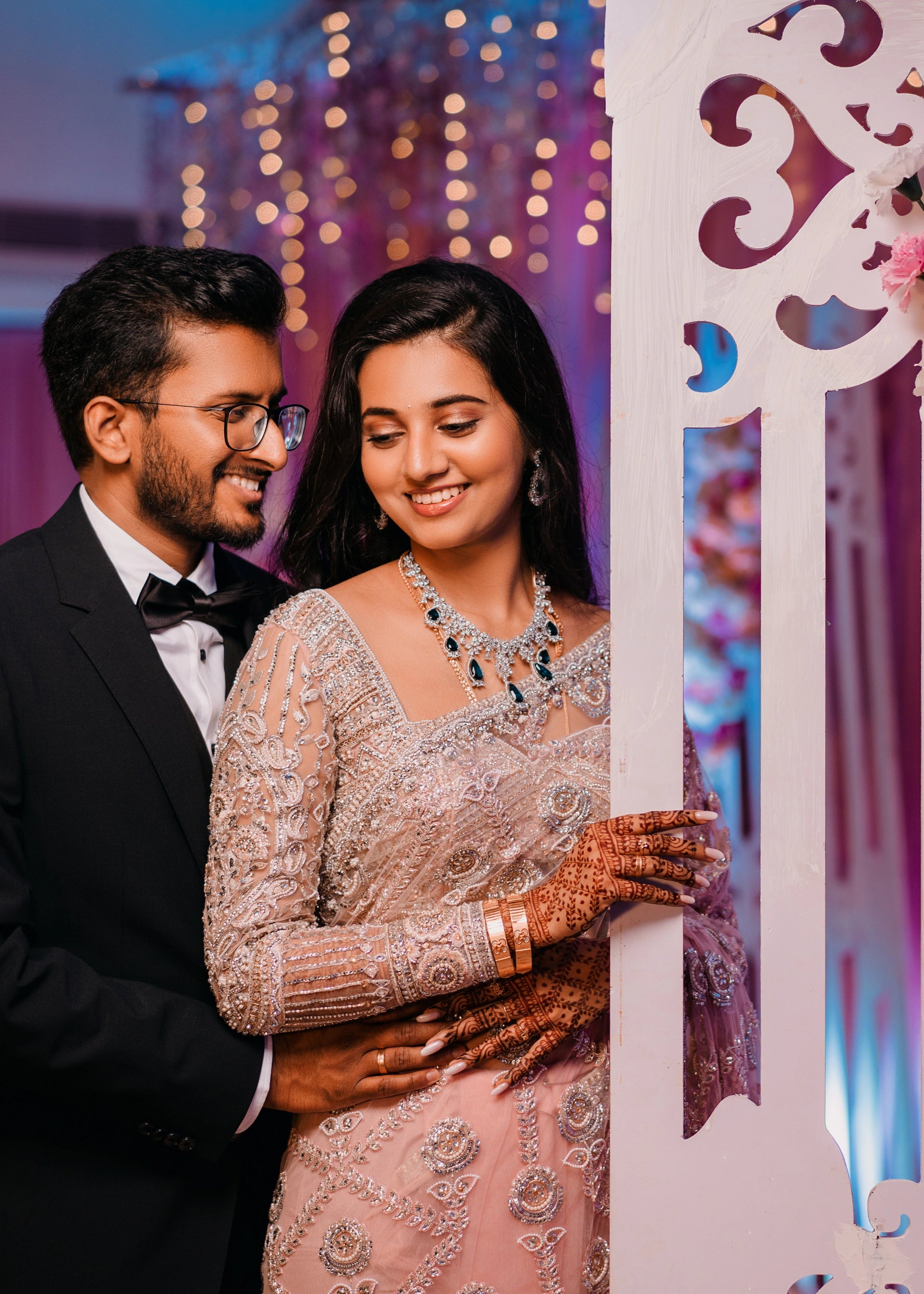 Bride from Berlin smiling in a concept pink tulle saree designed by Archana Karthick handcrafted with stones, crystal beads, cutdanas, resham work and sequins.