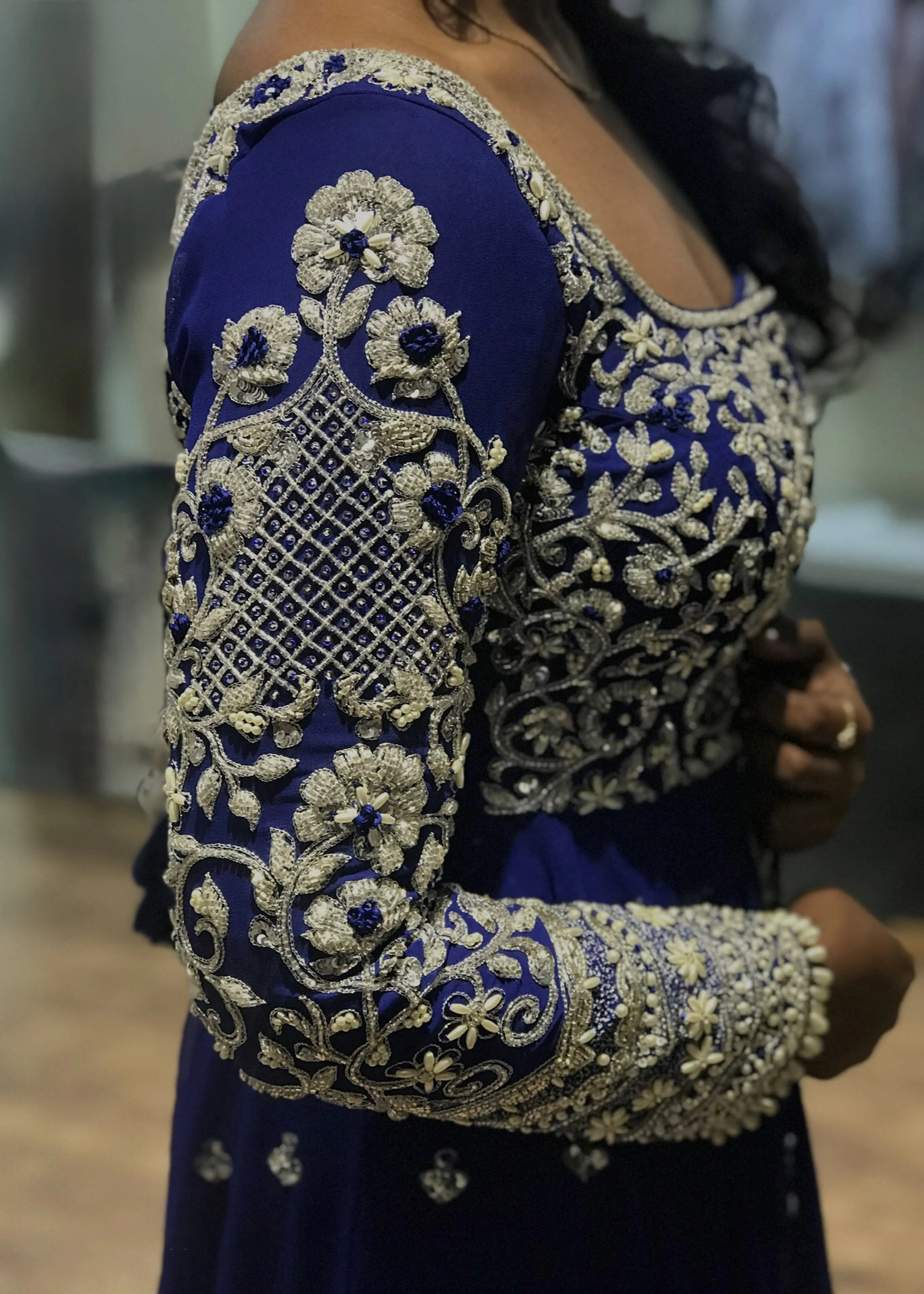 Bride from Chennai for her fittings session at the atelier in navy blue masakali lehenga with silver embellishments designed by Archana Karthick