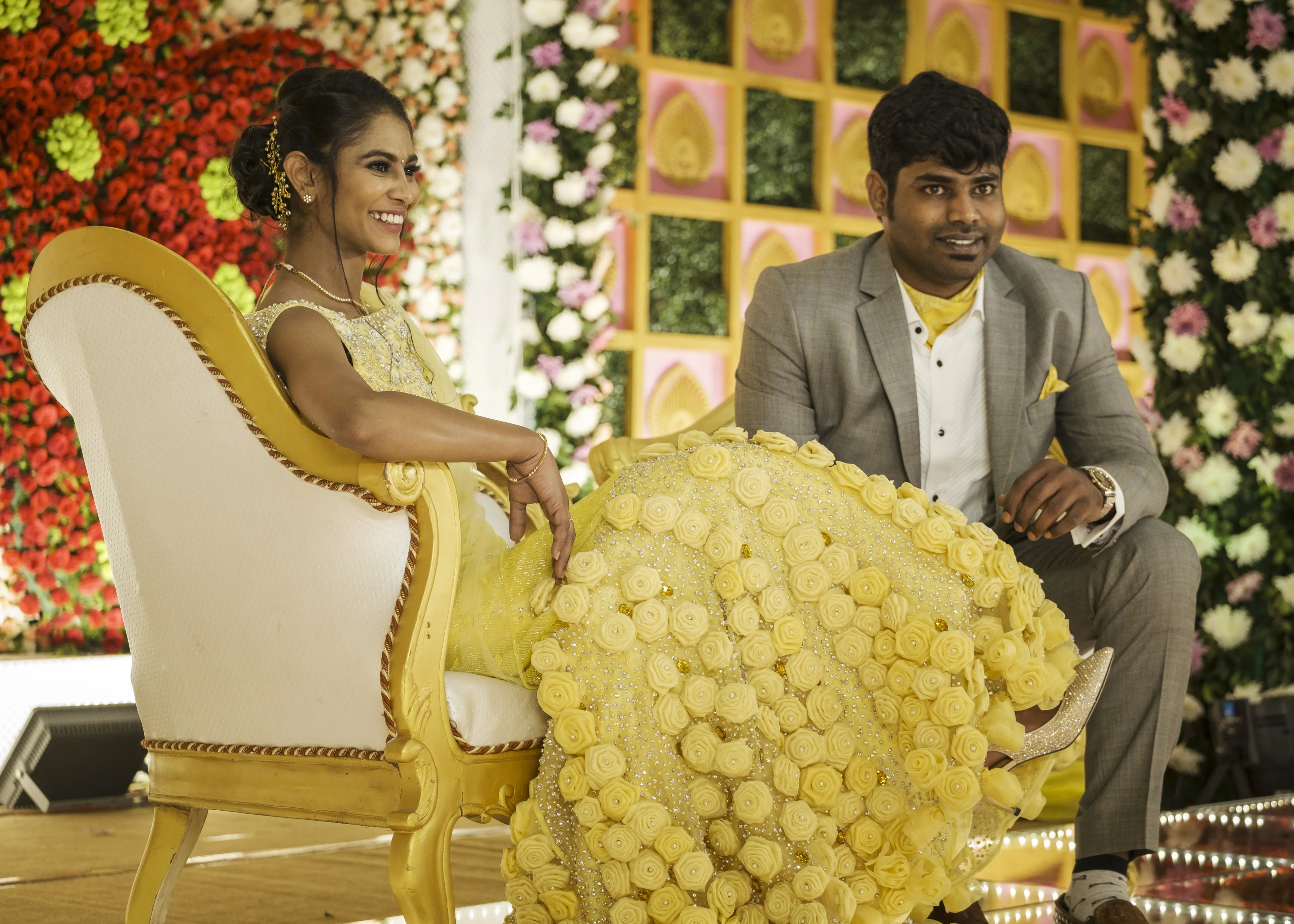Bride from Chennai in handcrafted yellow mermaid lehenga embellished with cut dana, pearls, rhinestones and handmade 3D flowers.