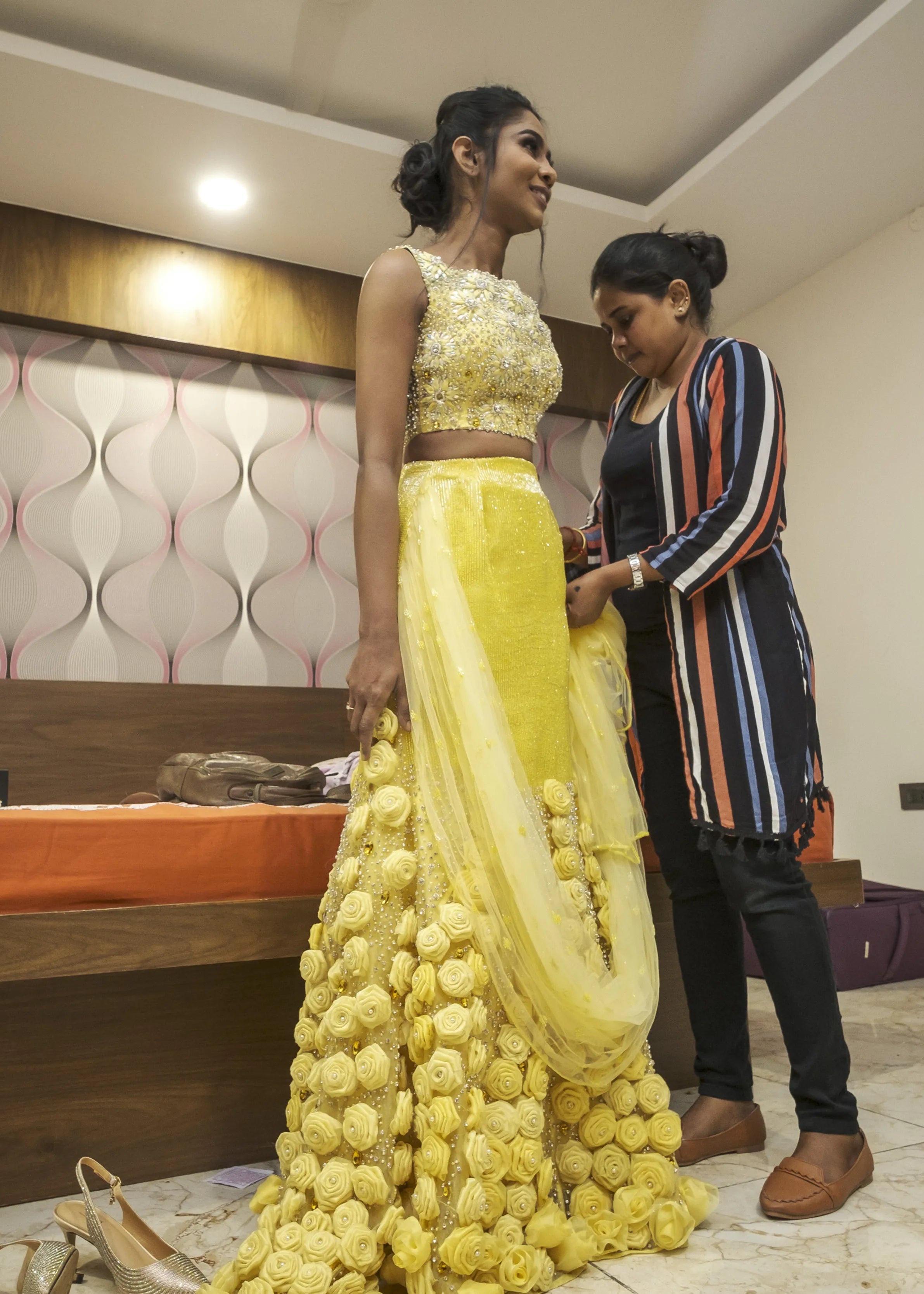 Bride from Chennai with makeup artist in handcrafted yellow mermaid lehenga embellished with cut dana, pearls, rhinestones and handmade 3D flowers.