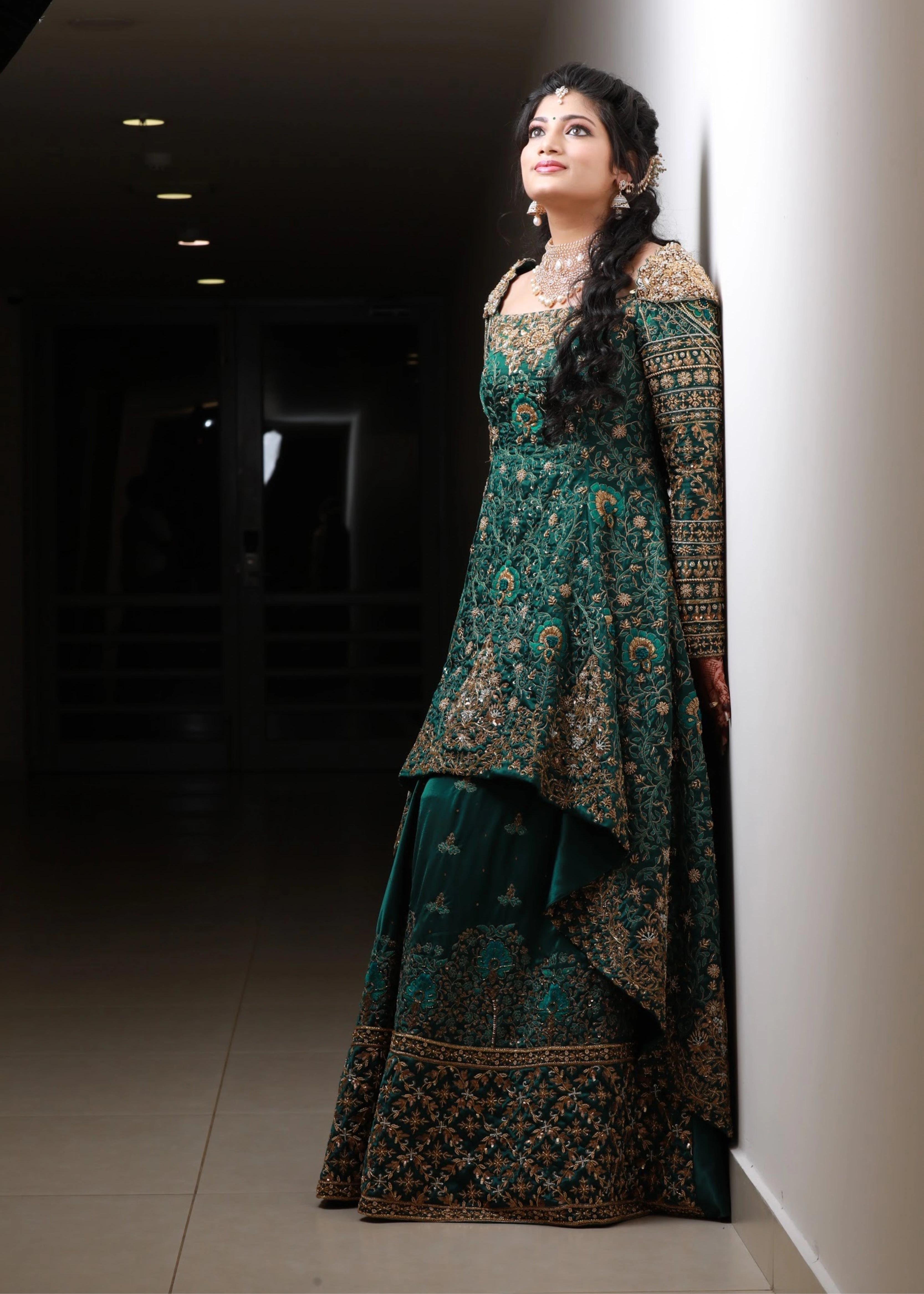 Bride from Kuwait in a bottle green satin silk masakali lehenga handcrafted with zardozi, rhinestones, crystals and more. Designed by Archana Karthick.