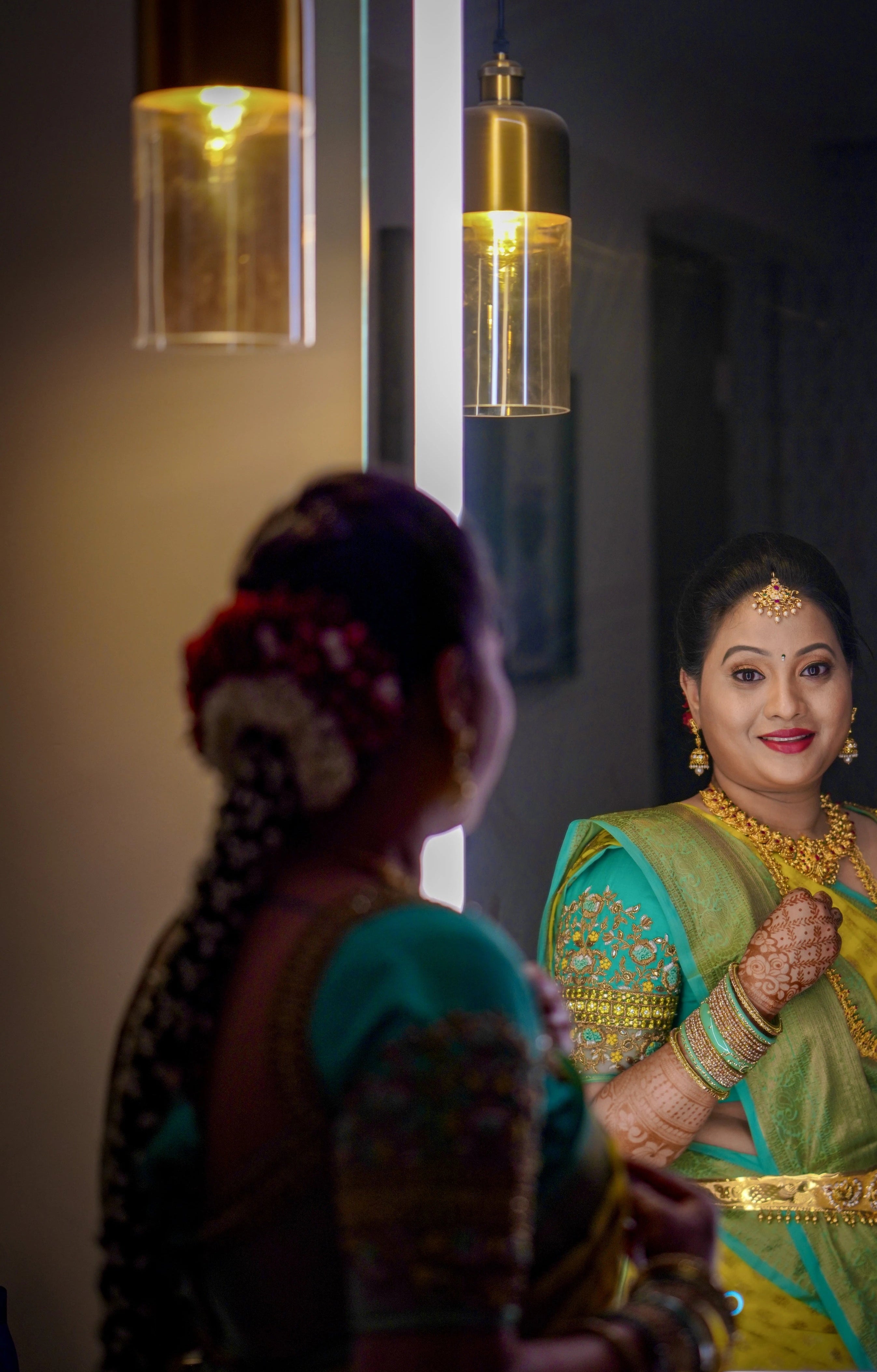 Bride from Seattle posing in an aquamarine blouse designed by Archana Karthick