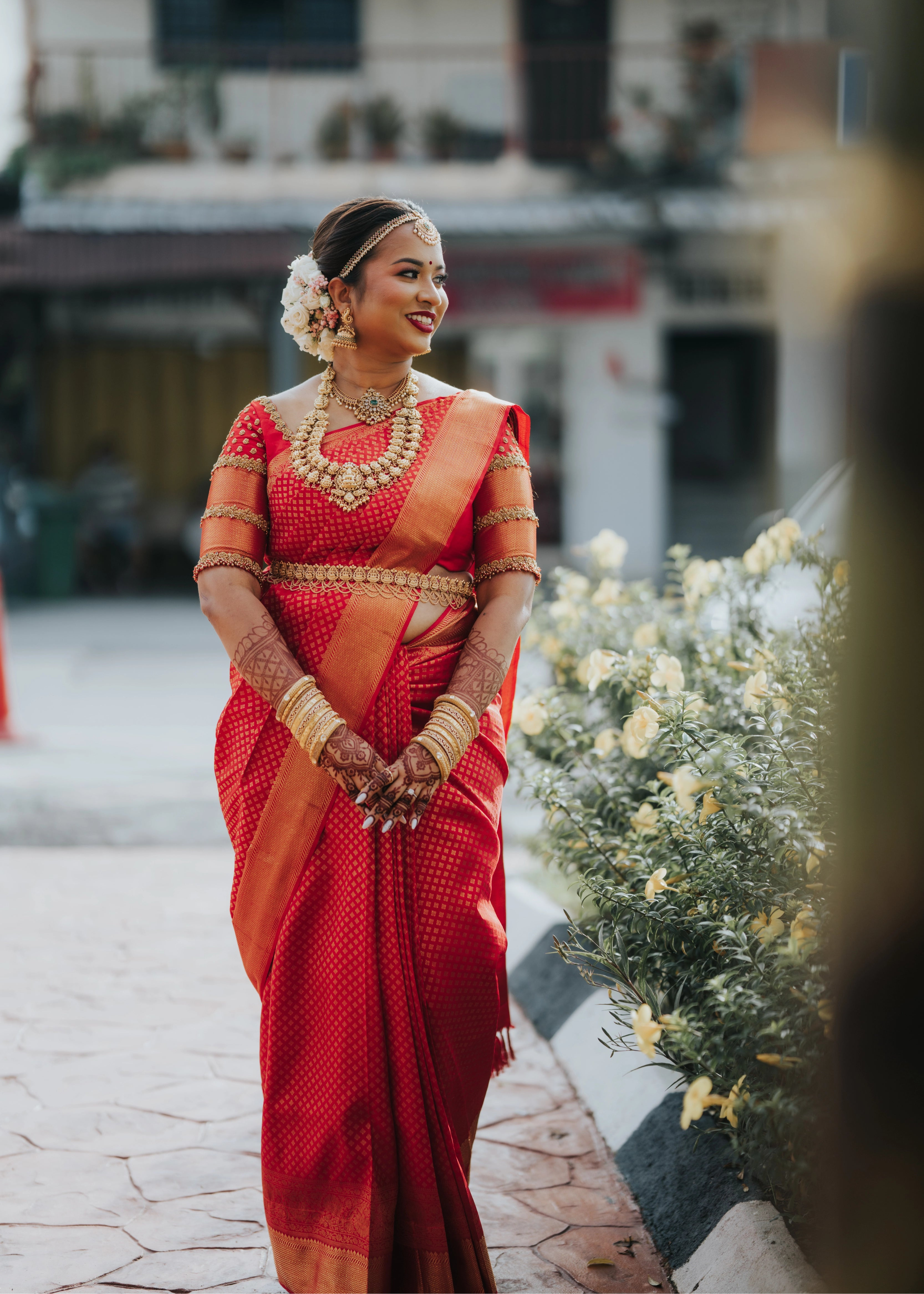 Bride front blouse design in a handcrafted palanquin concept red silk blouse features zardozi and beads. Designed by Archana Karthick.