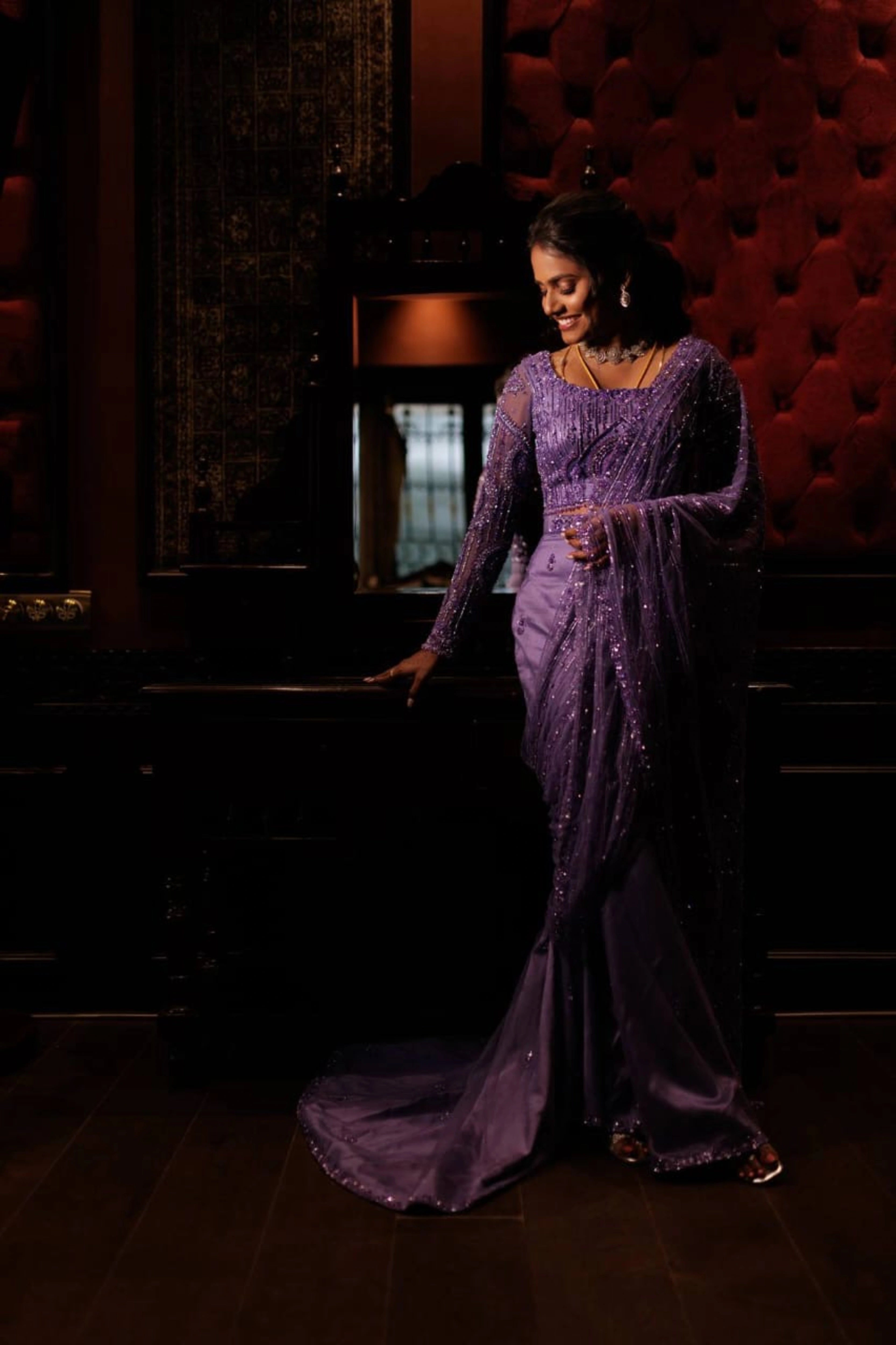 Bride Vishnu Karthika in a lavender tulle draped saree, handcrafted with rhinestones, zardozi, sequins, crystals, cutdana and resham by team Archana Karthick.