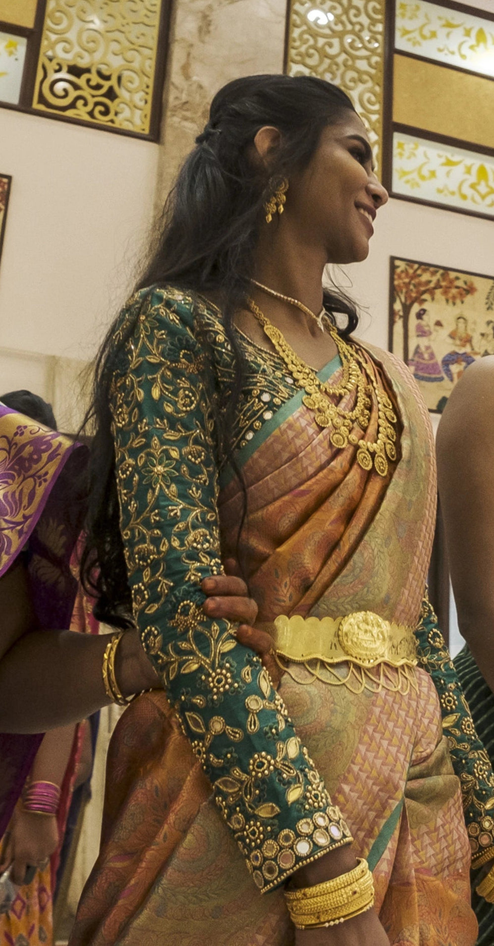 Bride walking in full sleeves green blouse for her wedding rituals designed by Archana Karthick