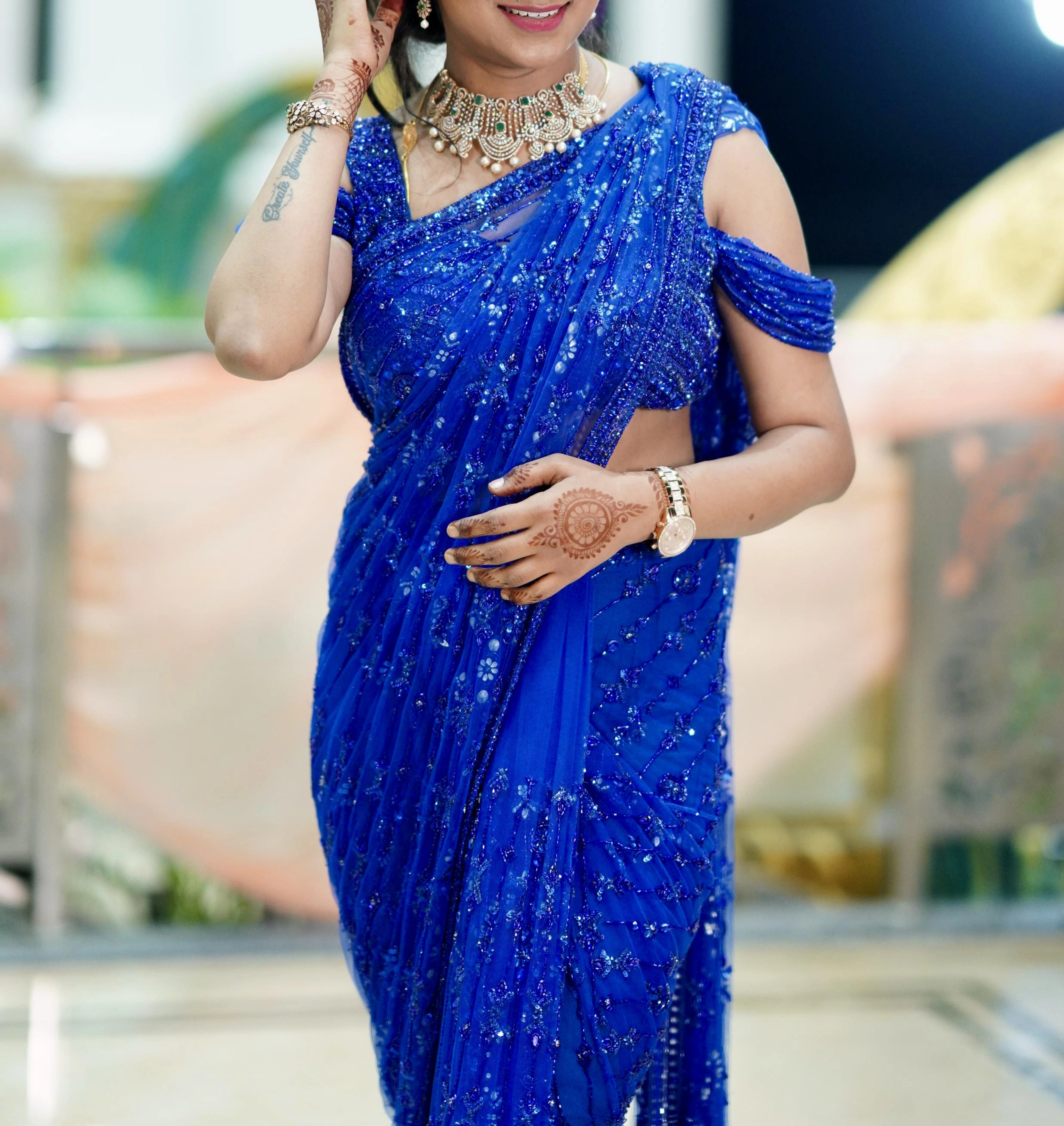 Bridesmaid Gouthami from Bangalore posing in a blue tulle saree, handcrafted by team Archana Karthick.